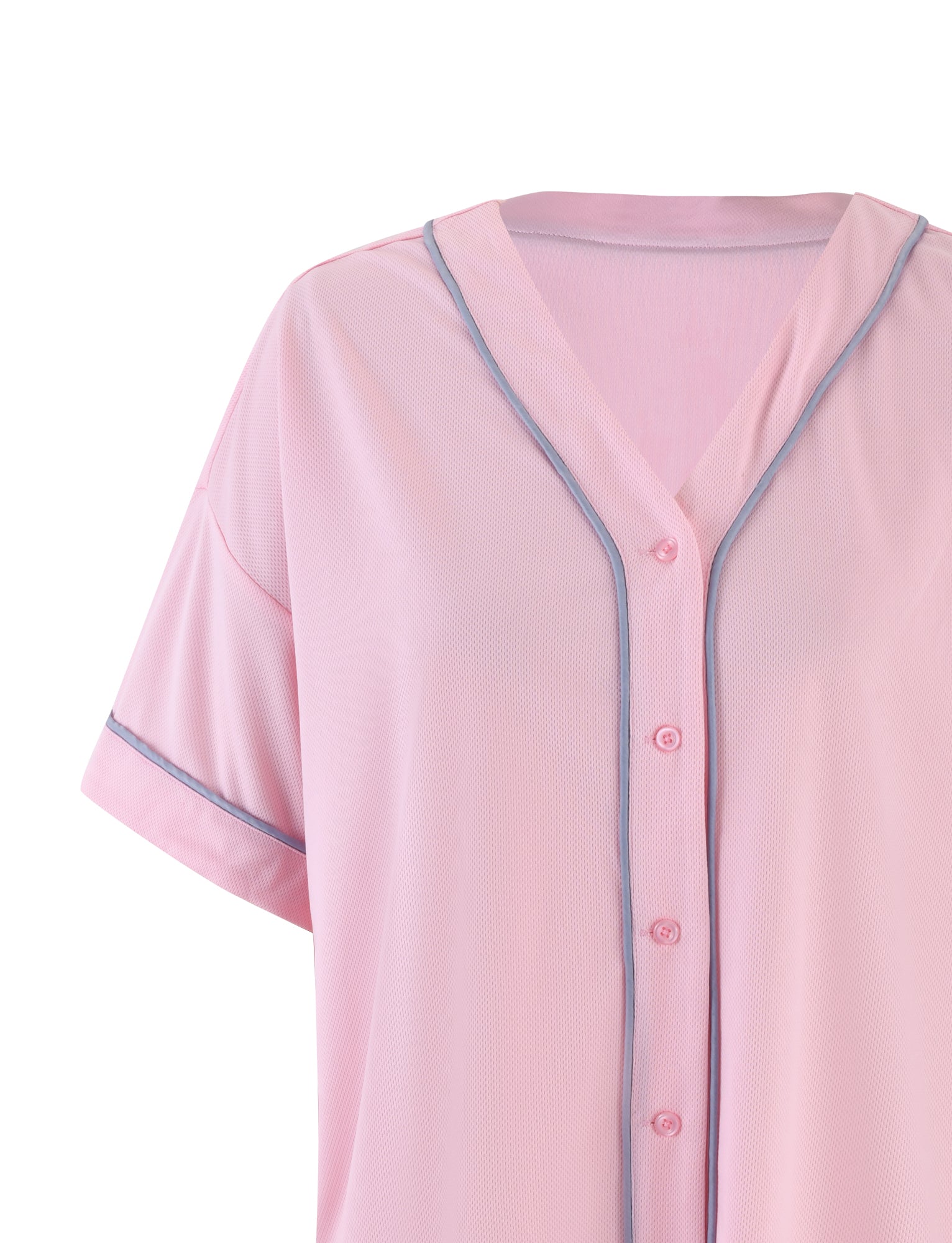A close-up of the TIGERMIST ZEA TOP - PINK : BABY PINK, showcasing its short-sleeve design with blue trim around the collar, sleeves, and button placket. The shirt features a V-neck collar and is made of a lightweight, sheer fabric.
