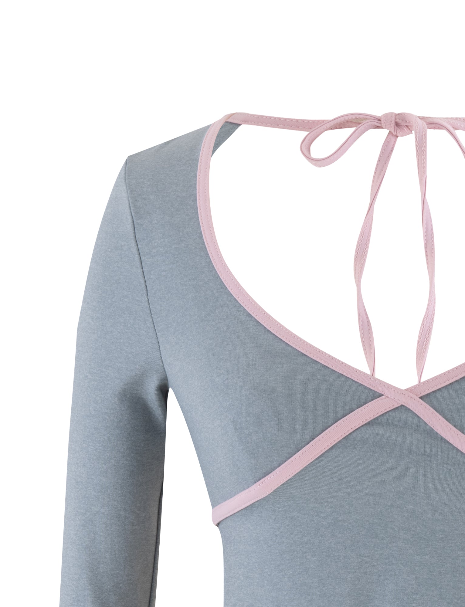 A close-up of the TIGERMIST ELESSAR TOP in GREY MARLE with long sleeves. The top showcases a deep V-neckline accented with pink trim, crossing at the bust, and an open back adorned with pink ribbon ties at the nape.