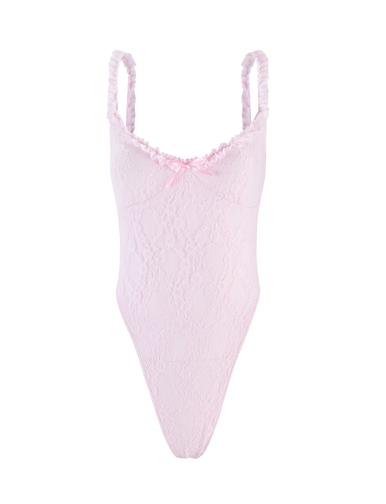 The DEJA BODYSUIT - PASTEL PINK by TIGERMIST features thin ruffled shoulder straps, a small satin bow at the center of the neckline, scalloped trim at the bust, and a high-cut leg design. The pink lace bodysuit showcases a delicate floral pattern for an intricate and delicate appearance.