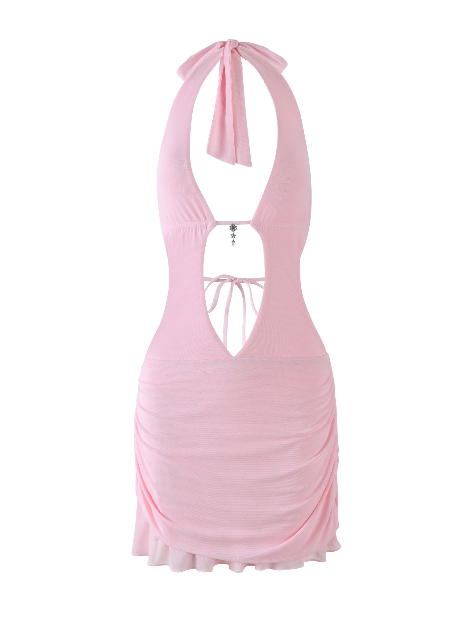The ESHA DRESS - PINK by TIGERMIST is a baby pink halter-neck mini dress featuring a bodycon fit, open back with tie closure, ruched sides, flared hem, back cut-out detail, and a decorative charm on the upper back.