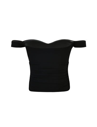 The SAFAA TOP - BLACK from TIGERMIST is a black off-shoulder crop top designed with short sleeves. The fabric appears soft and form-fitting, featuring subtle ruching on the sides for a textured look. It also has a sweetheart neckline, adding an elegant touch.