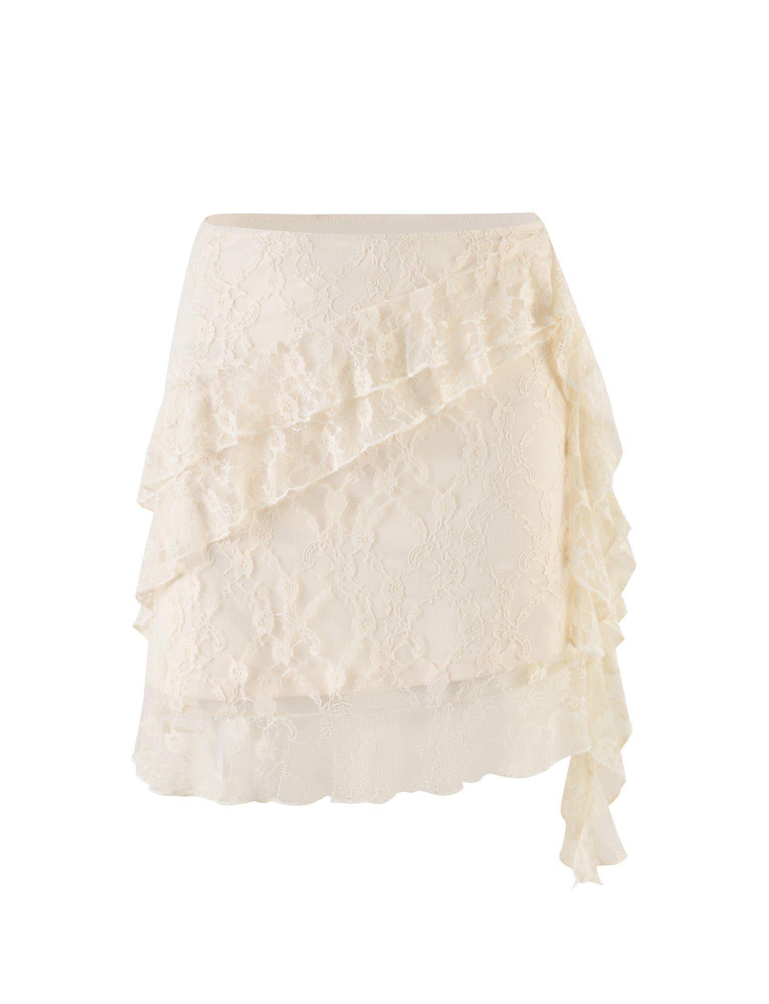 The STORMI LACE SKIRT by TIGERMIST, in a champagne beige lace, features a fitted waist and an asymmetrical ruffled hem. This knee-length skirt boasts a delicate, elegant design with floral lace patterns that create a layered effect with multiple ruffles cascading down one side.