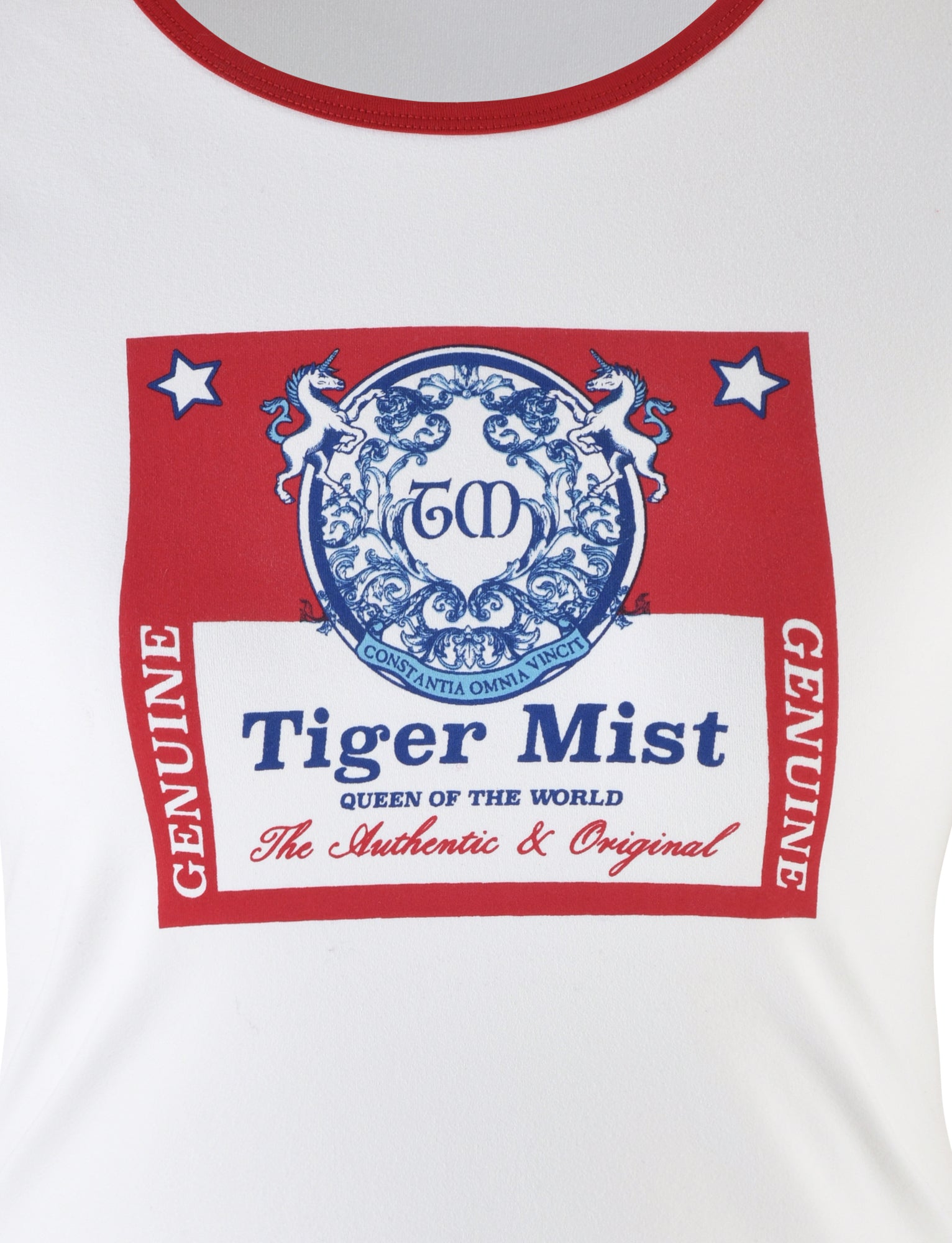 The Siobhan T-Shirt in white from TIGERMIST features a large red and blue graphic. The upper section shows two stars and unicorns surrounding a circular emblem with "CM." Text reads "Tiger Mist" and "Queen of the World," with "Genuine" on vertical red borders. Below, it states "Tiger Mist: The Authentic & Original.