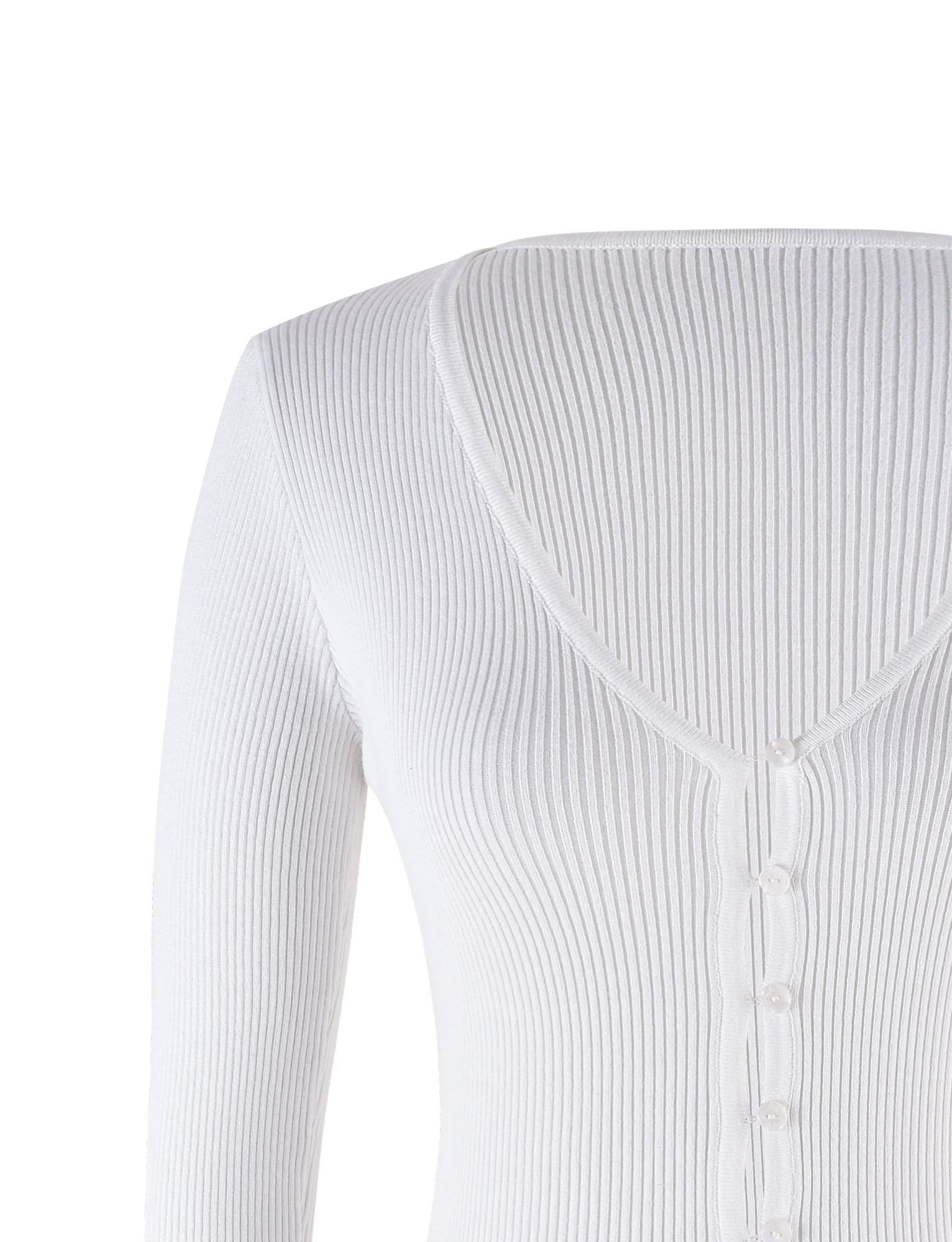 The image shows the upper back and shoulder area of a person wearing the DEVON CARDIGAN - WHITE from TIGERMIST. This ribbed cardigan features a v-shaped neckline at the back and a row of small white buttons running down the center.