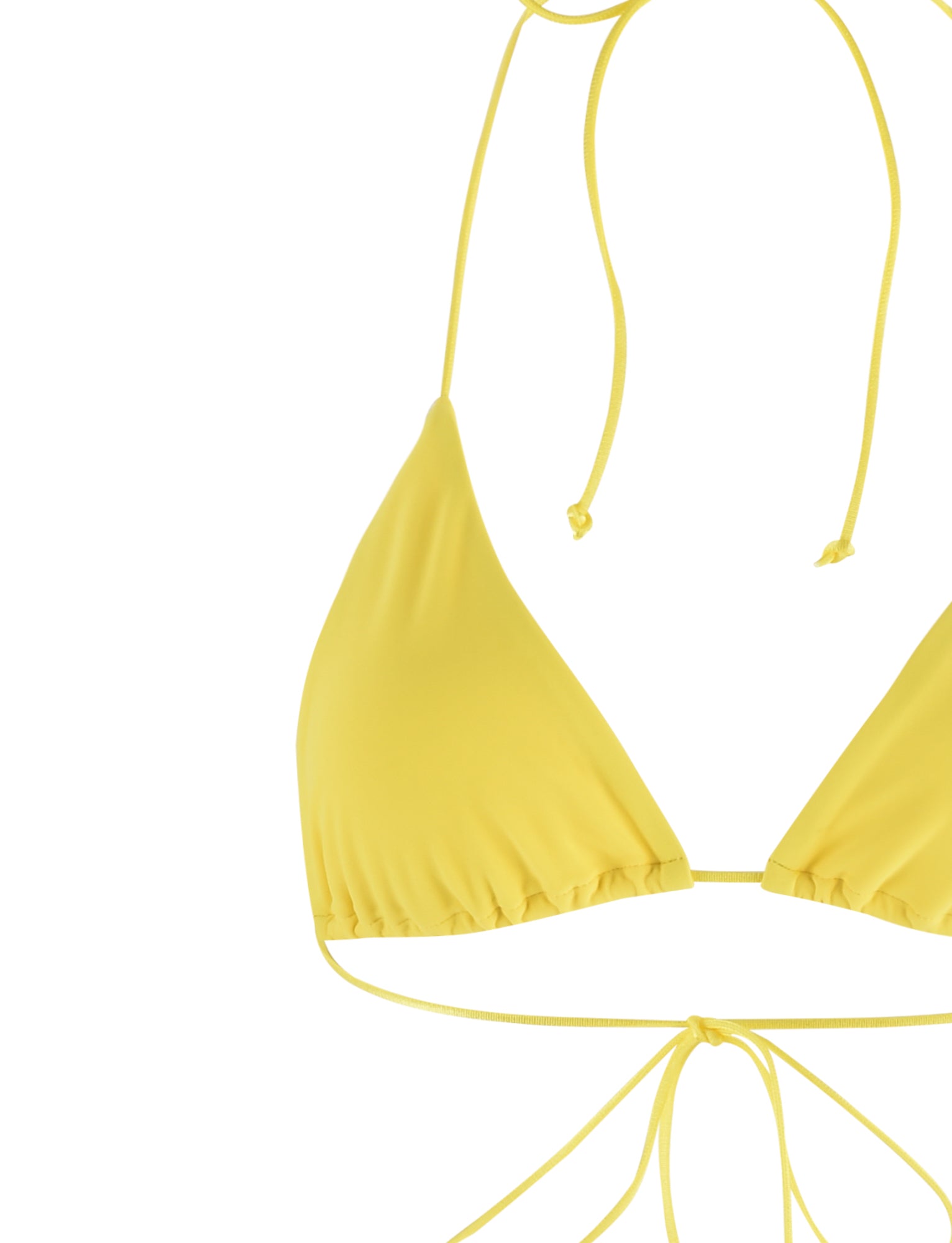 A close-up image of the TIGERMIST KRYZE BIKINI TOP - YELLOW : NEON YELLOW showcasing its triangular cups and thin string ties at the neck and back. The smooth fabric softly reflects light, while the white background makes the bright neon yellow color stand out prominently.
