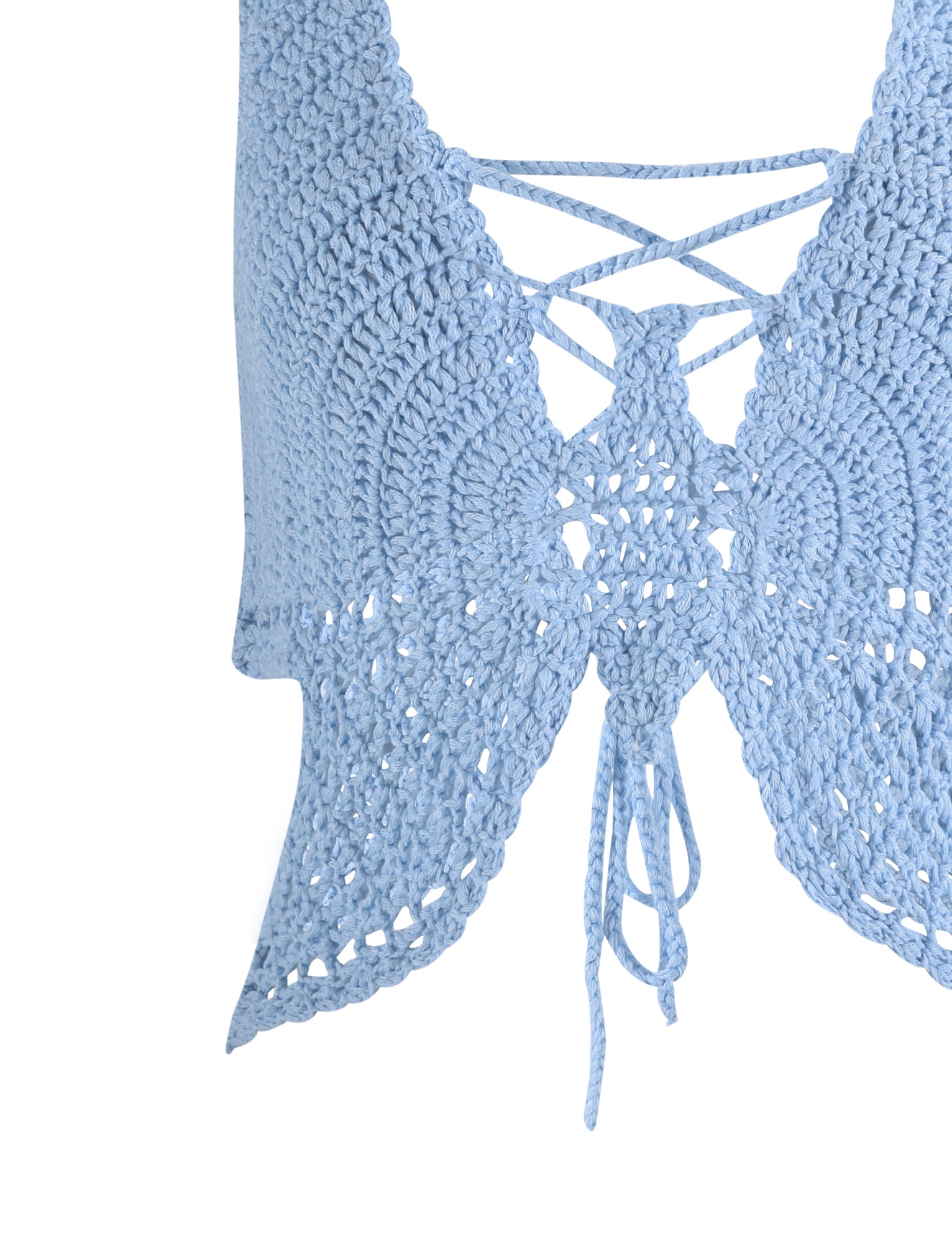 A close-up of the TIGERMIST AZADI TOP - BLUE in Baby Blue, showcasing intricate open-knit craftsmanship. The crochet crop top features crisscross lace-up ties at the front, ending with dangling strings.