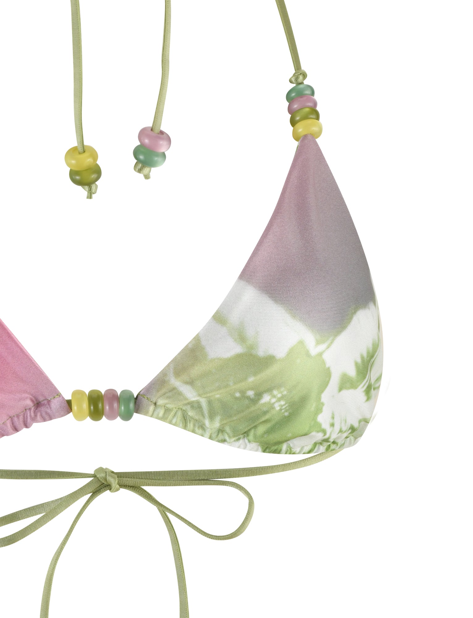 Close-up of the TIGERMIST FINLEA BIKINI TOP, showcasing a tropical print and a halter neck design. The green straps are adorned with pastel-colored beads, and the fabric features a soft gradient pattern in pink, green, and white hues. The bikini top ties at the back with a bow made from the green straps.