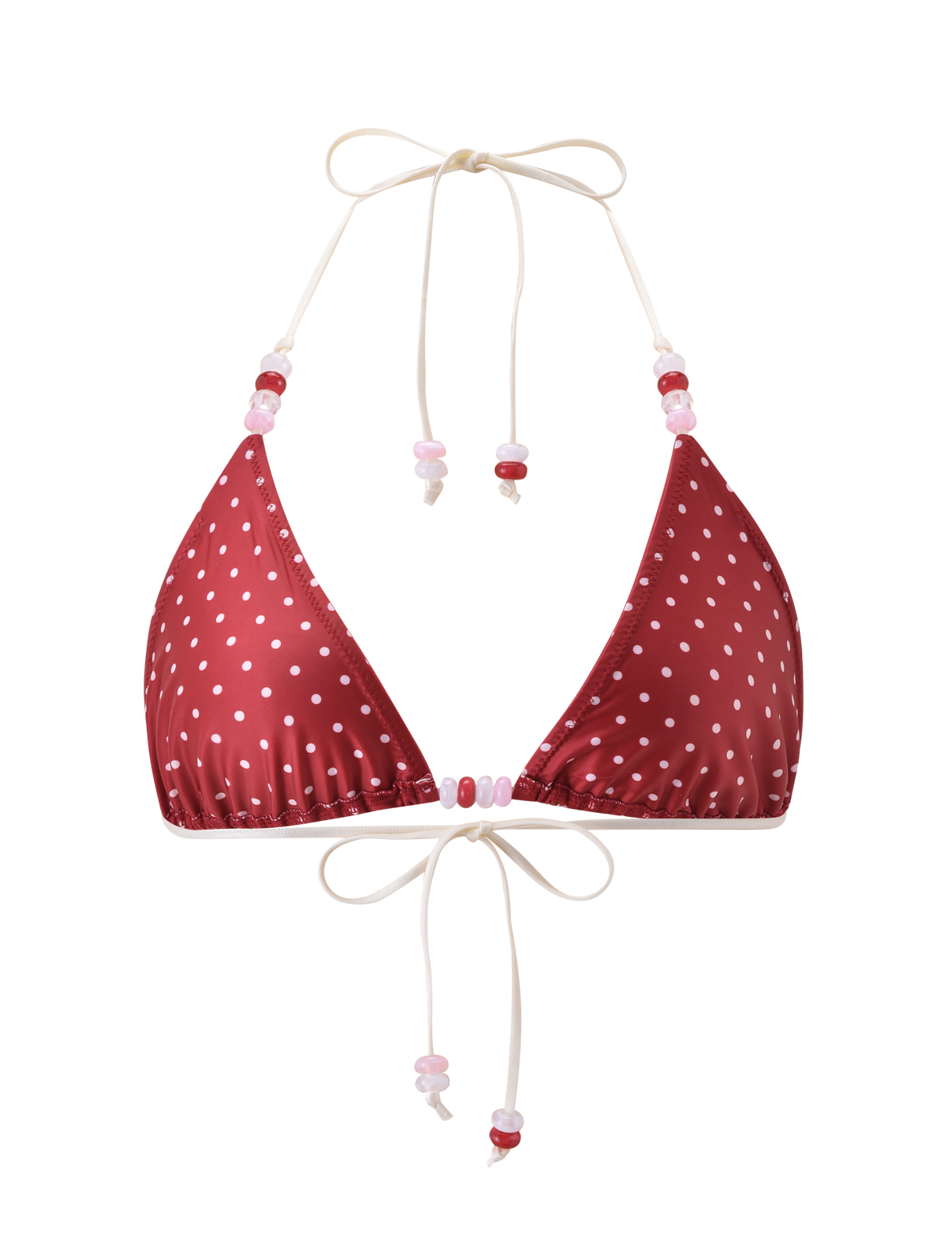 The FINLEA BIKINI TOP by TIGERMIST features a red and cream polka dot design, white string ties, colorful beaded accents on the straps, and a classic triangle silhouette, shown against a plain white background.