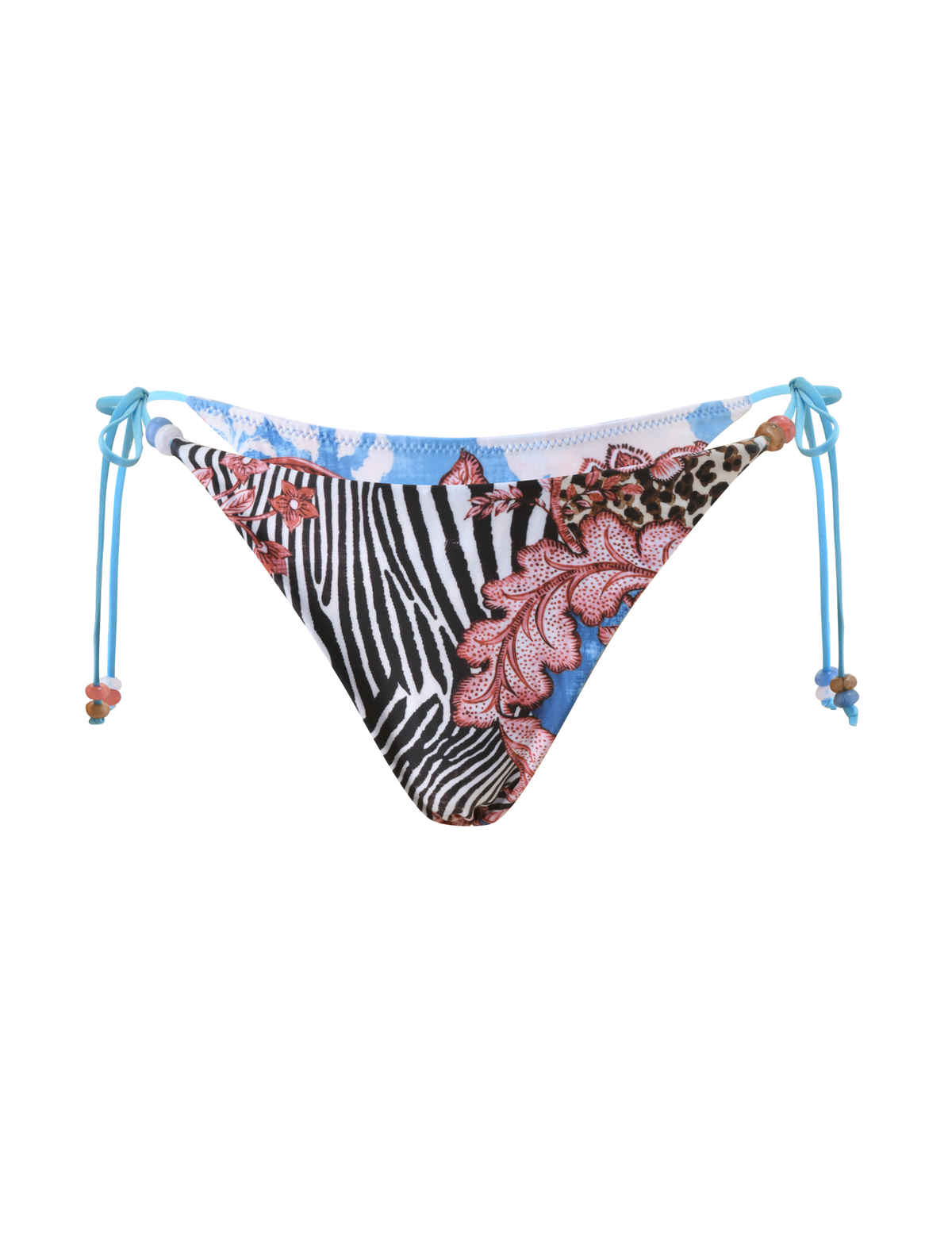 The TIGERMIST FINLEA BIKINI BOTTOM - GLOBAL ANIMAL HAZE features a cheeky cut with blue side ties and a patchwork of animal and floral prints, including zebra stripes, pink lace designs, and blue accents on a white base.
