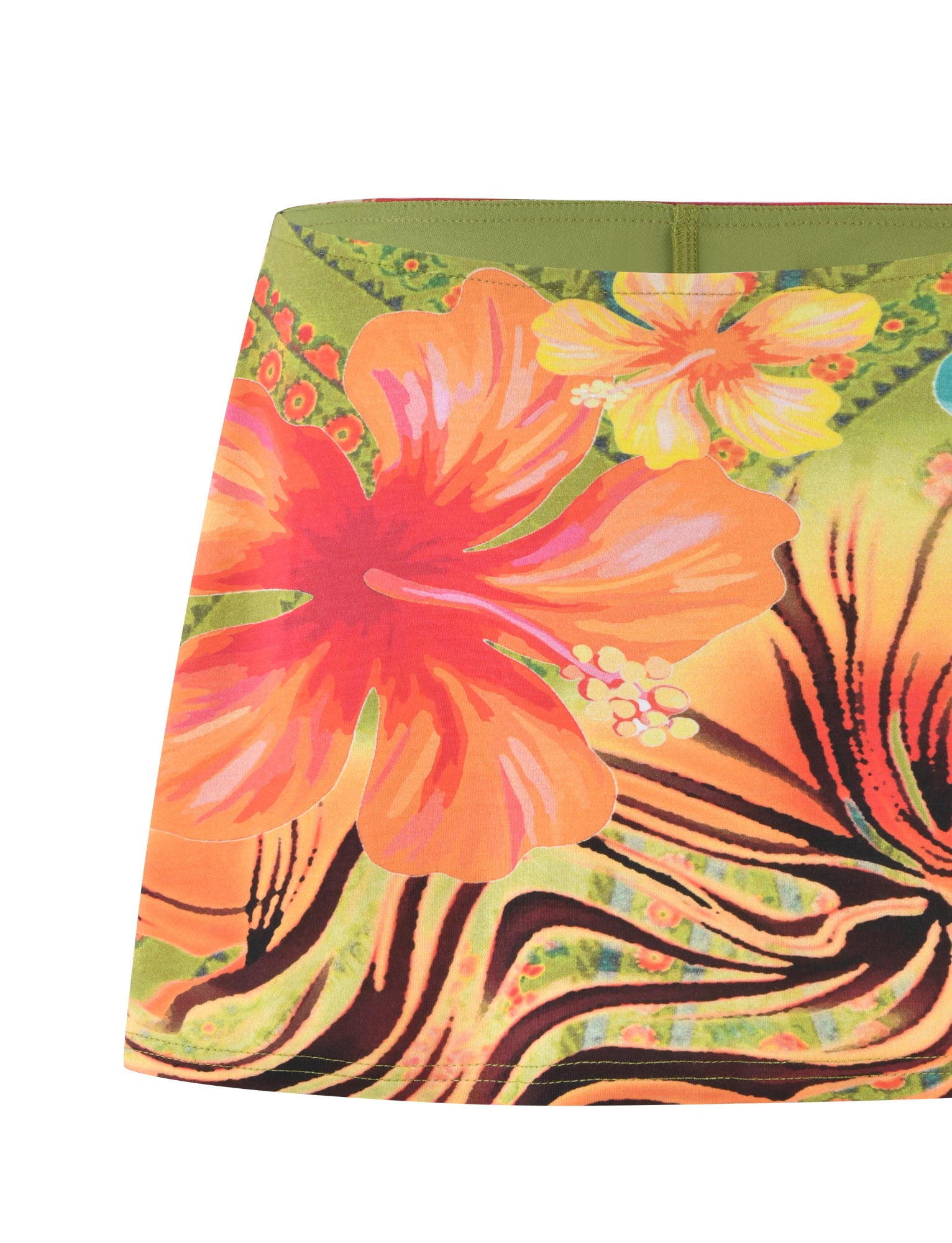 Close-up of the QUINLEY SKORT from Tigermist, showcasing vibrant tropical floral patterns with large, bold hibiscus flowers in shades of orange, pink, and yellow set against a background of green and black swirling designs. The hem is straight, and the material appears to be fabric.