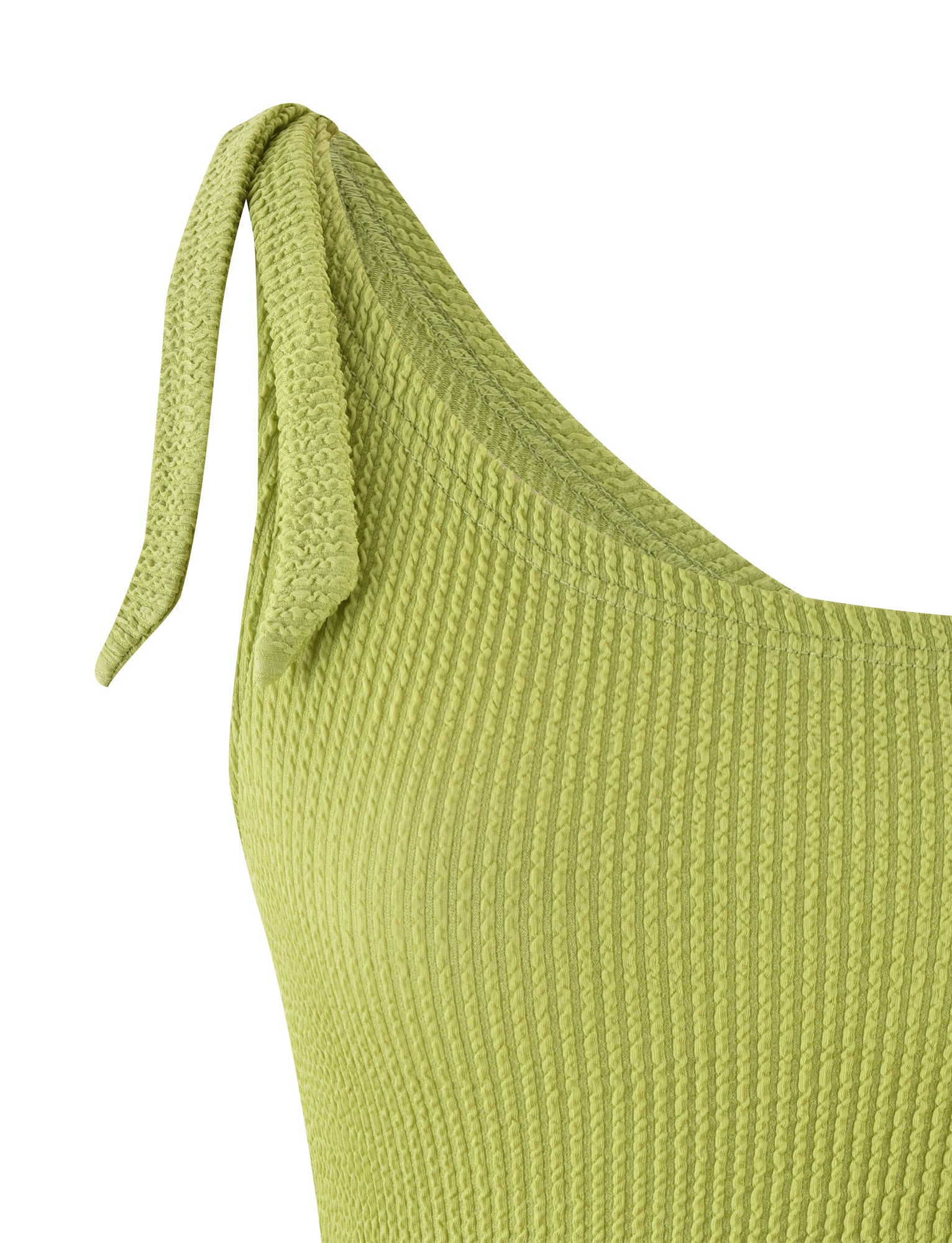 Close-up of the DEANNA TOP - GREEN : LIME GREEN from TIGERMIST, showcasing a ribbed knit fabric with a tie detail on the shoulder. The textured pattern of the material and the decorative tie enhance the overall design. The image focuses on the upper part of the top, highlighting its material and stitch style.