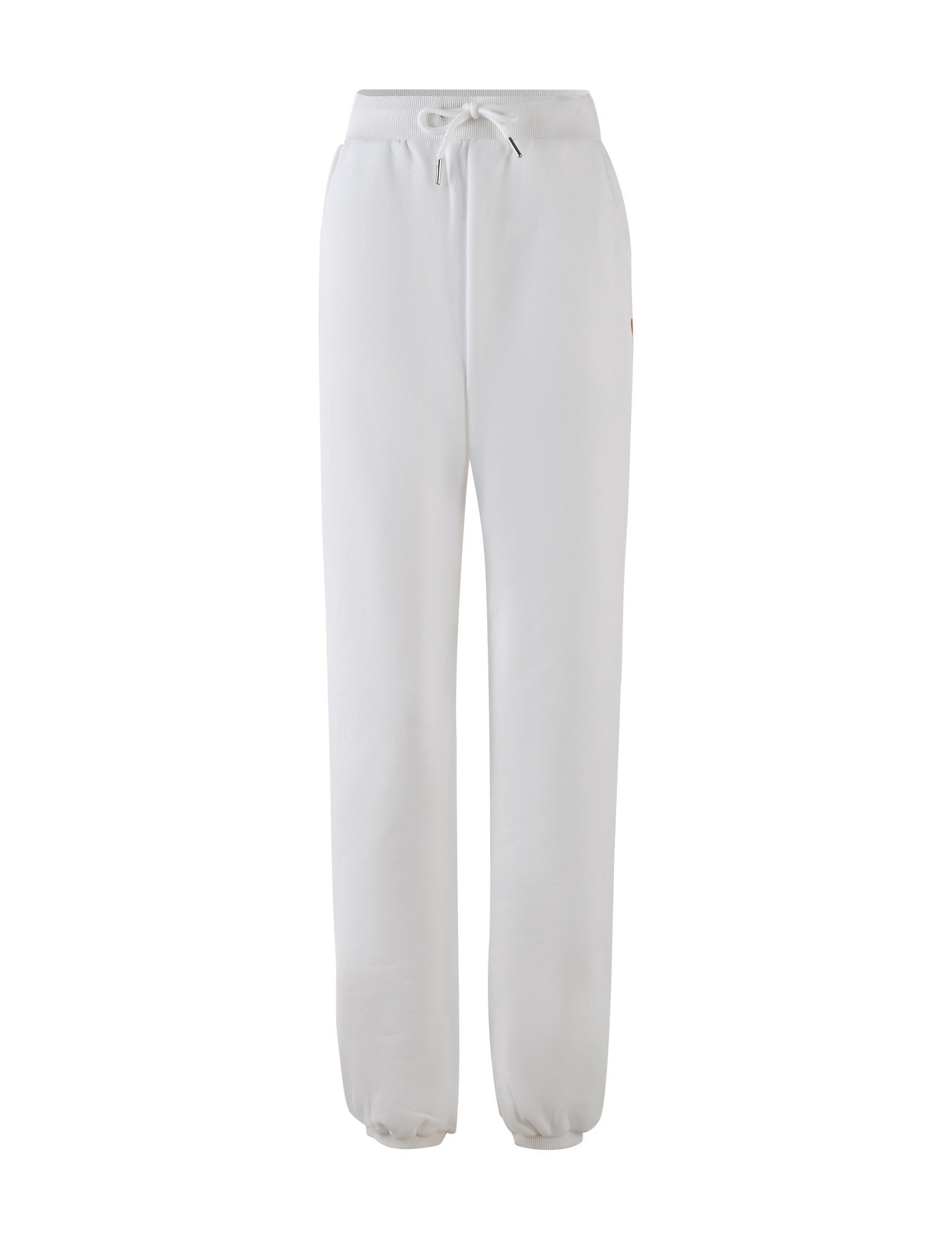 The LUMEN PANT in white by TIGERMIST is a pair of mid-rise loungewear pants featuring an elastic waistband and drawstring tie. These sweatpants offer a relaxed fit with tapered legs and elastic cuffs at the ankles, creating an oversized trackpant silhouette. They also include subtle seam pockets on each side.