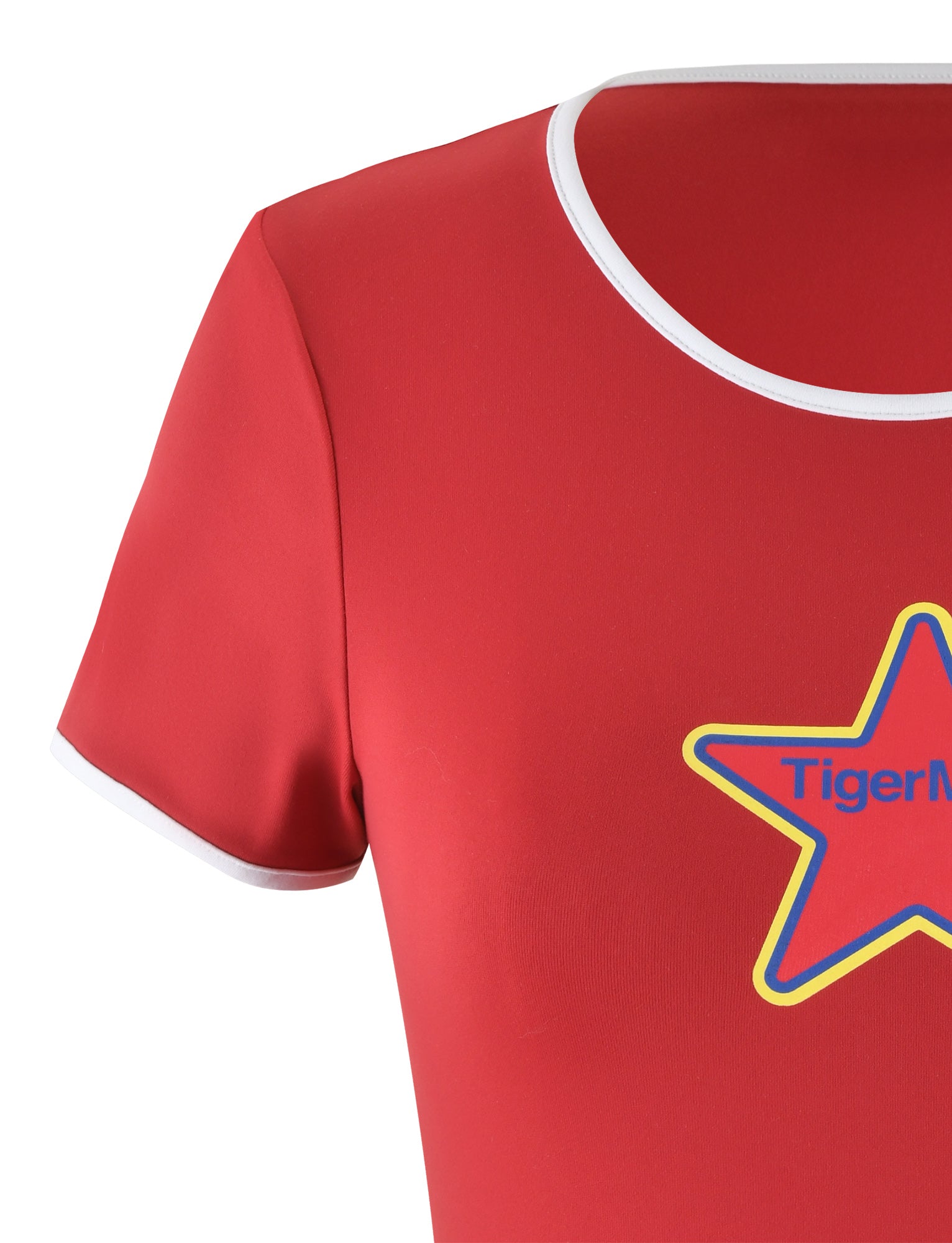 Close-up of the DELANEY TEE - RED from TIGERMIST. It features short sleeves with white trim around the collar and sleeve edges. The chest displays a colorful red and yellow star design, with the text "TIGERMIST" partially visible.