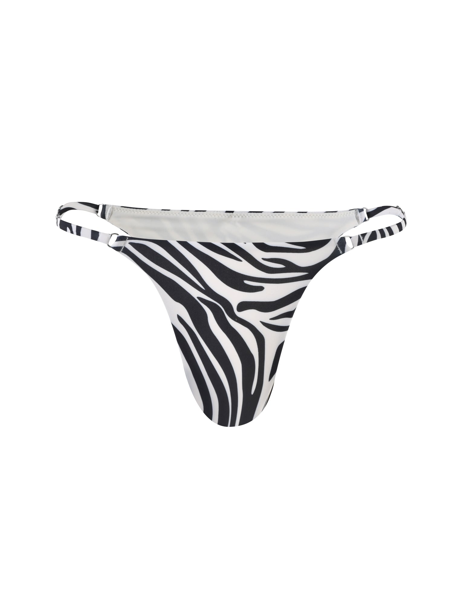 An image of the DIVINA BIKINI BOTTOM - BLACK : ZEBRA from TIGERMIST showcases a zebra-striped bikini bottom with thin side straps. The fabric features a black and white zebra print pattern, creating a bold and striking visual effect. This bikini bottom boasts a minimalistic and contemporary design.