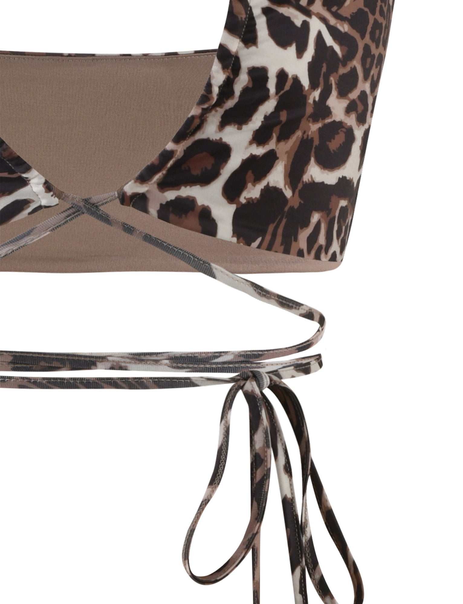 Close-up of the TIGERMIST Cynthia Top - Multi: Leopard crop top with thin spaghetti straps. The fabric showcases a leopard print pattern consisting of black, brown, and beige spots. Two straps crisscross at the midriff and tie into a bow, adding an elegant decorative touch.