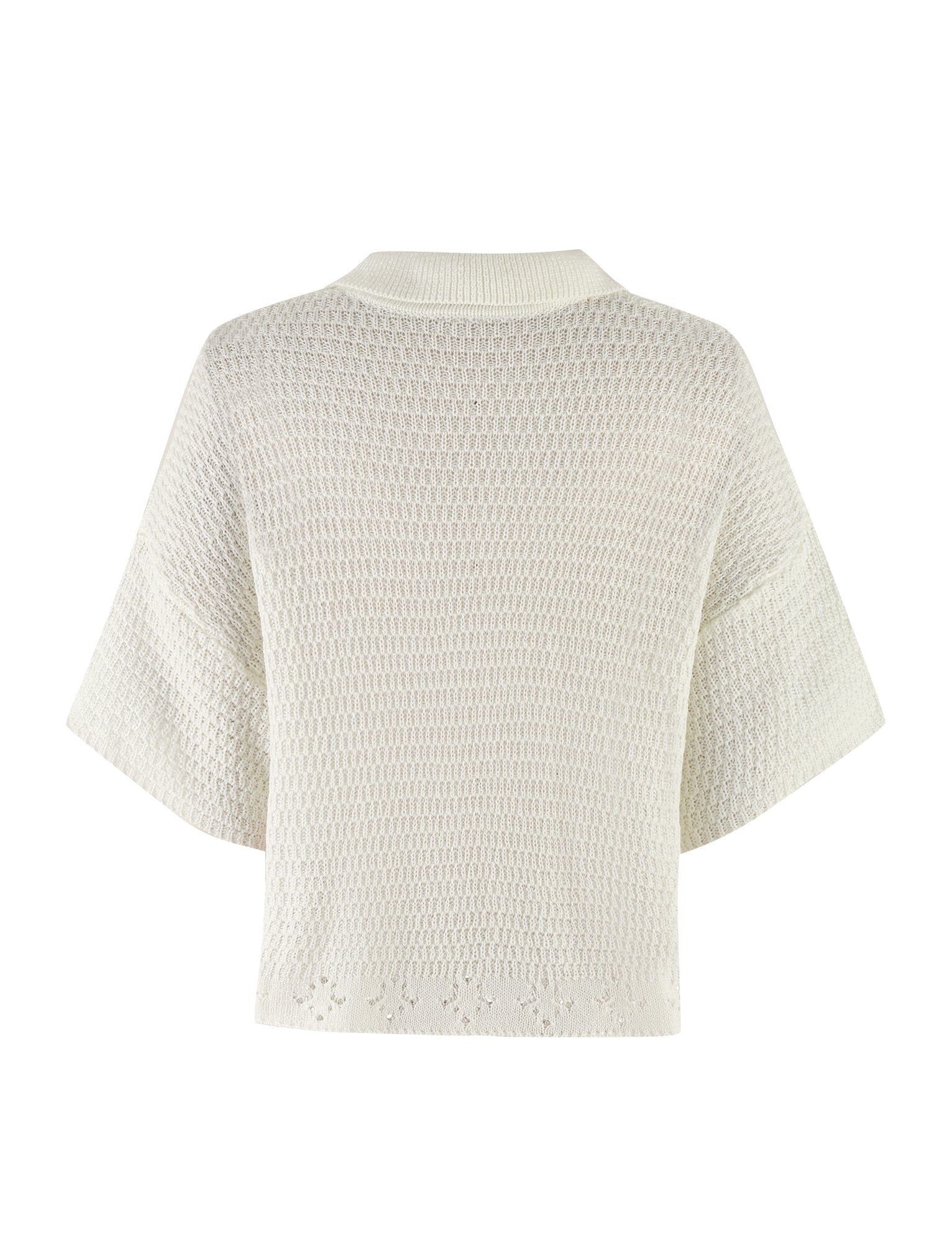 A back view of the JANAI TOP - WHITE : CREAM by TIGERMIST, showcasing its short, wide sleeves and textured, slightly open-weave crochet pattern. The top features an oversized fit and a ribbed collar, enhancing its relaxed appeal.
