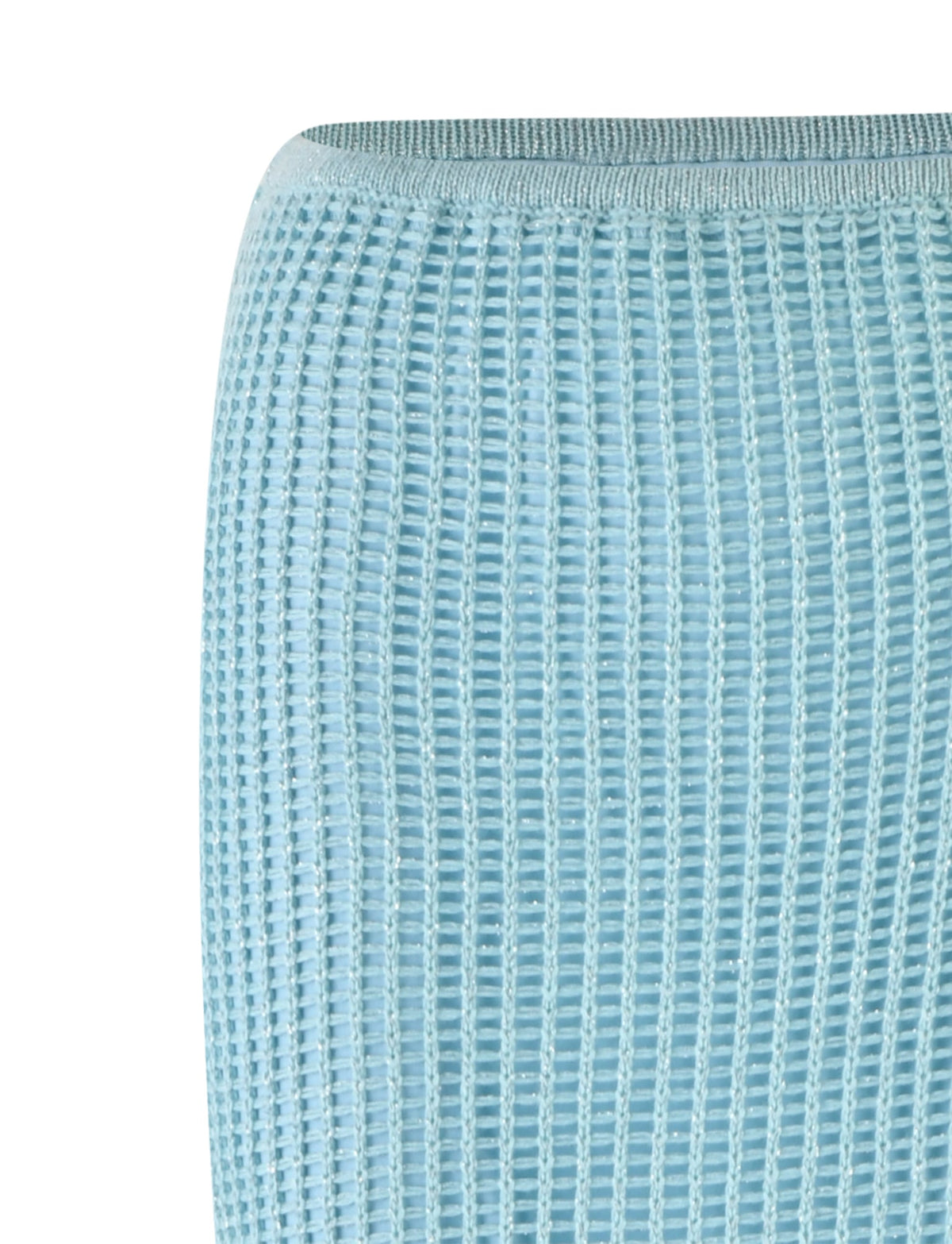 Close-up of the SHAH SKIRT in Pale Blue from TIGERMIST, showcasing its textured fabric with a grid-like woven pattern. The skirt appears soft and slightly stretchy. Only a portion of the fabric is visible, filling most of the frame with its intricate, uniform design.