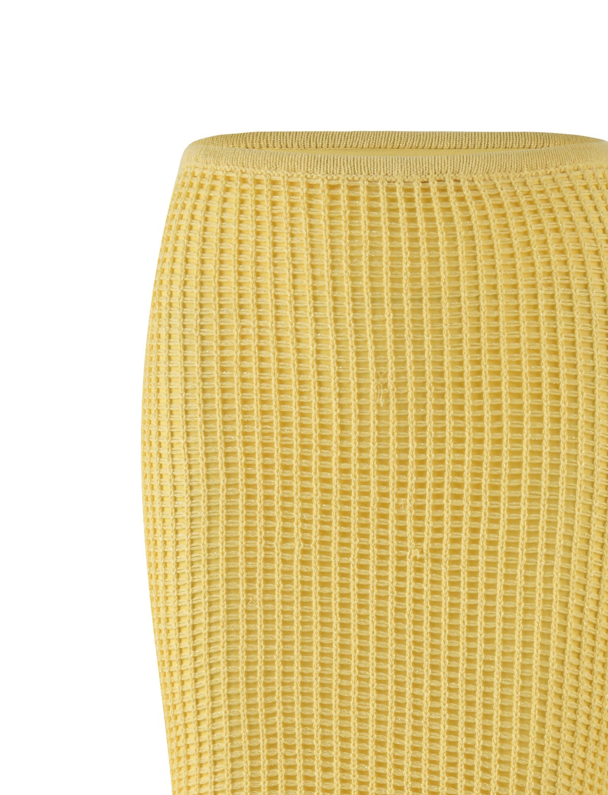 The image showcases a close-up view of the SHAH SKIRT - YELLOW : LEMON by TIGERMIST. The fabric, featuring a ribbed, waffle-like texture, is part of a maxi length garment perfect for warm weather. The knit pattern is uniform and presented in a bright, cheerful yellow.