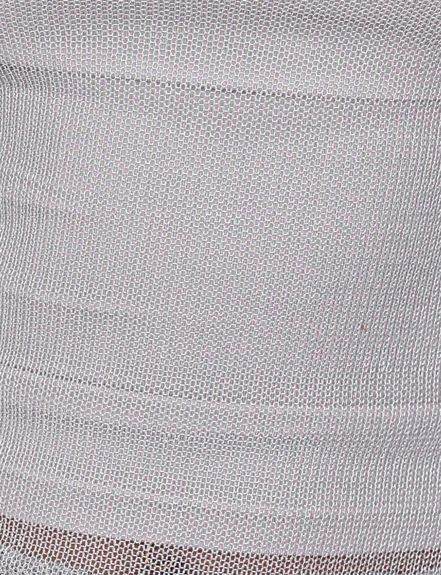 Here's a close-up of the WYNNE TOP - GREY : SILVER by TIGERMIST, showcasing its woven fabric with a dense, repetitive pattern of interlocking loops. The material appears soft and flexible with a subtle sheen reminiscent of silver metallic knit, featuring light gray and white hues.