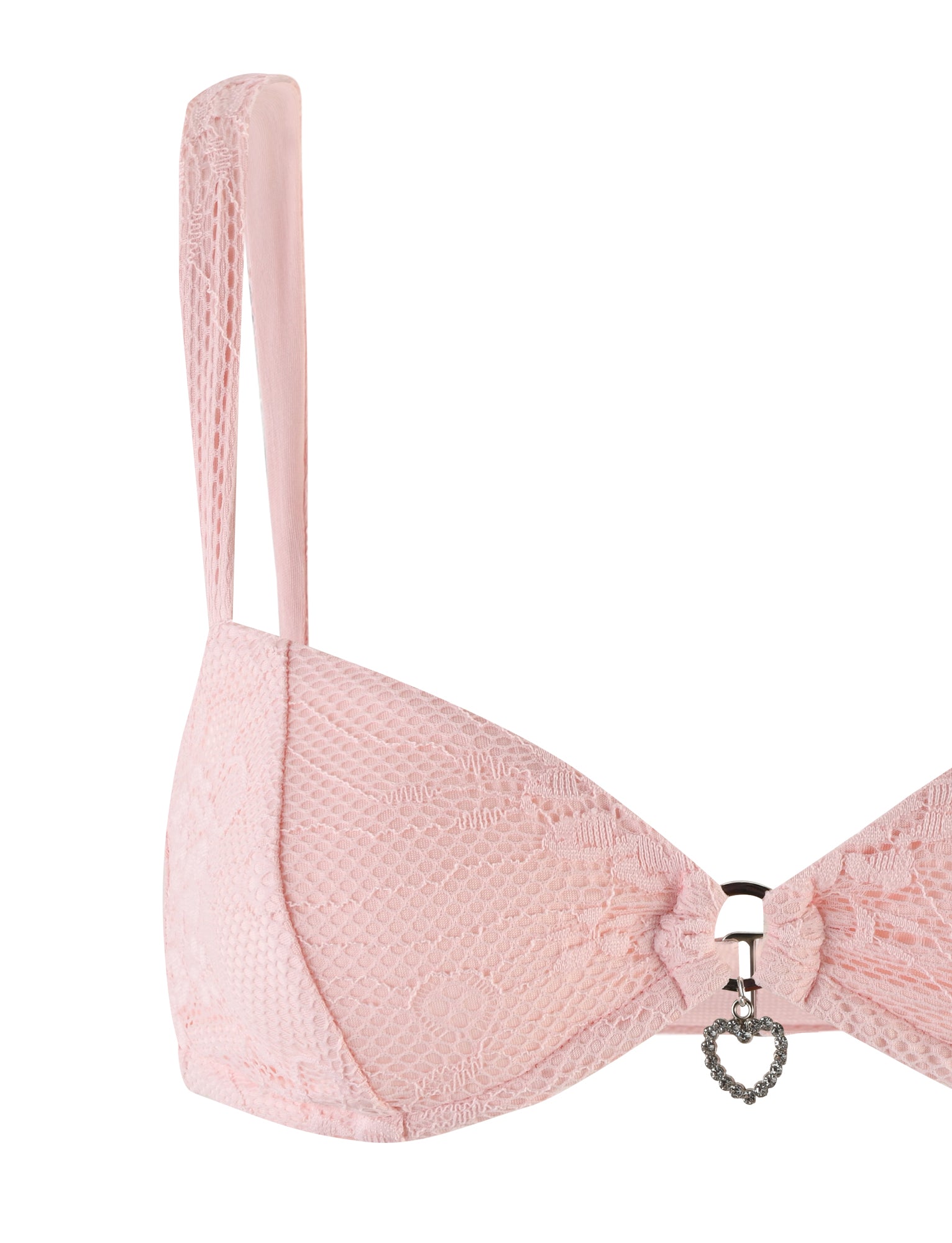 A pastel pink Xadie Top by Tigermist, featuring thin straps and a small heart-shaped charm at the center. The intricate lace pattern adds a delicate and feminine touch to the design.