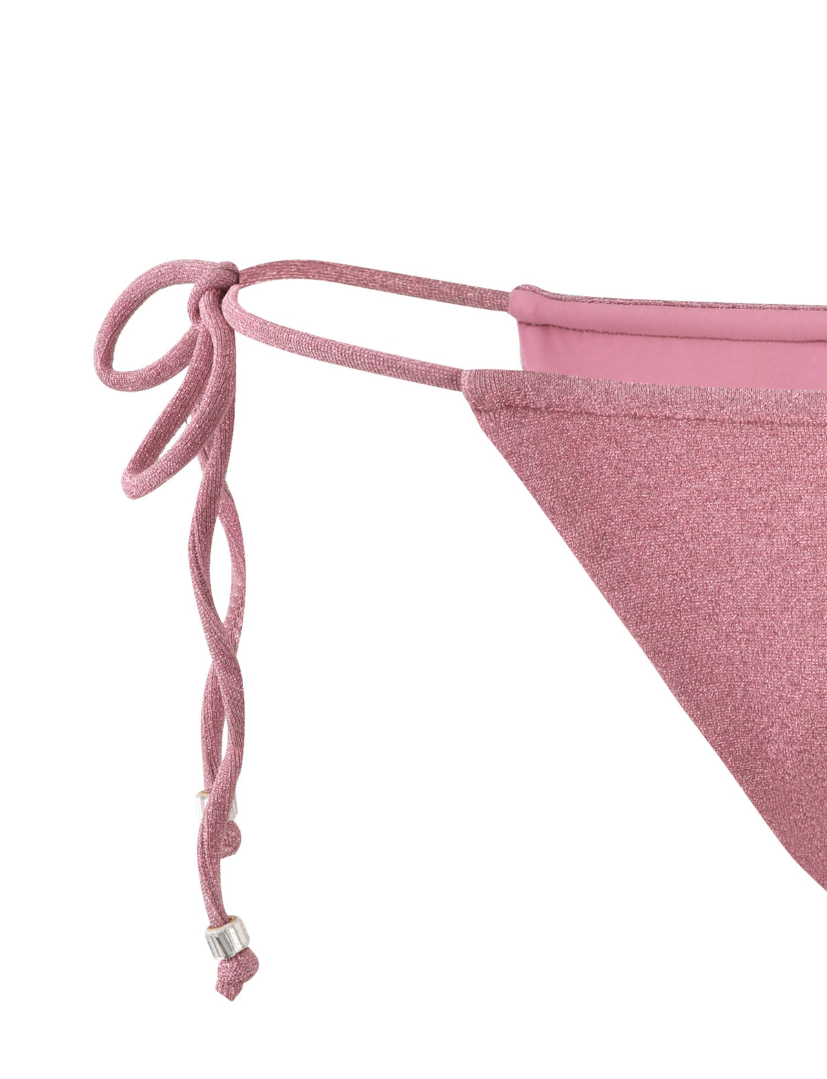 Close-up of the TIGERMIST MARIEL BIKINI BOTTOM - PINK : PINK SPARKLE. The side-tie bottom is tied with a double knot and features silver beads at the ends of the ties. The fabric has a textured, glittery appearance.