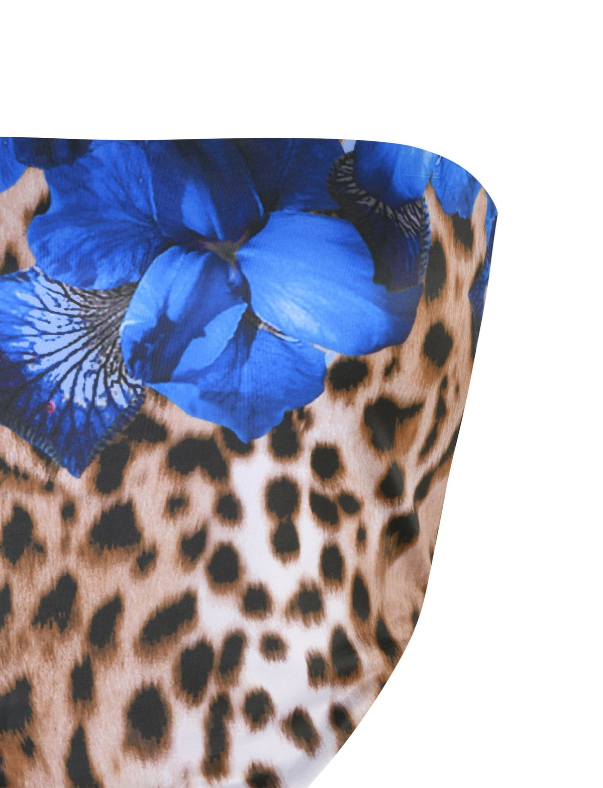 Close-up of fabric featuring a mixed print design: a cheetah or leopard pattern in brown and black tones, overlaid with large blue flowers. The textile appears smooth and is likely part of the BRIXLEY TOP - MULTI : LEOPARD from TIGERMIST.