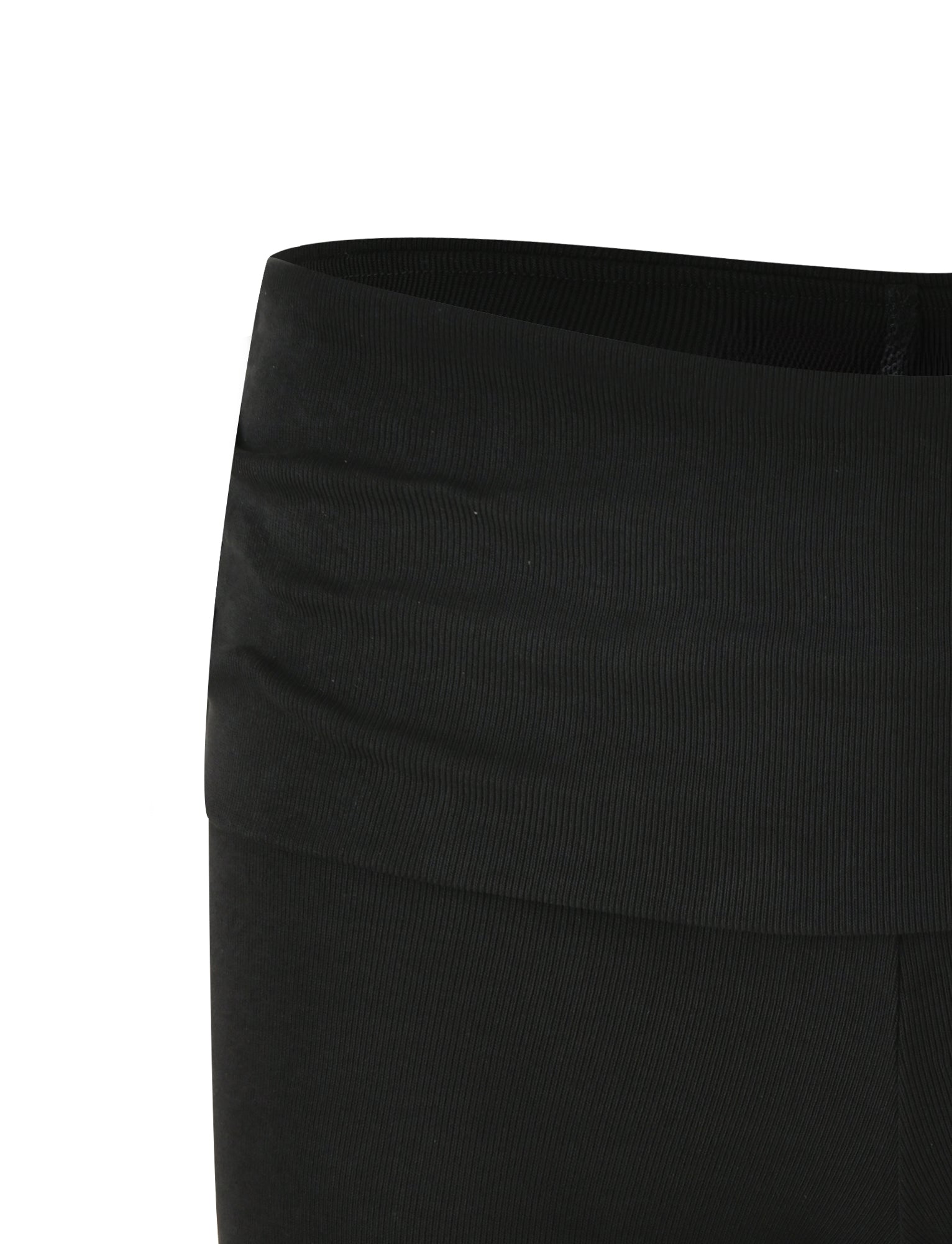 A close-up view of the waistband and upper section of the KARINA RIB SHORT - BLACK from TIGERMIST. The fabric is smooth with a slight stretch, showcasing a low-rise waist design. Visible stitching highlights the curve of the waistband, and no additional details or patterns are present.