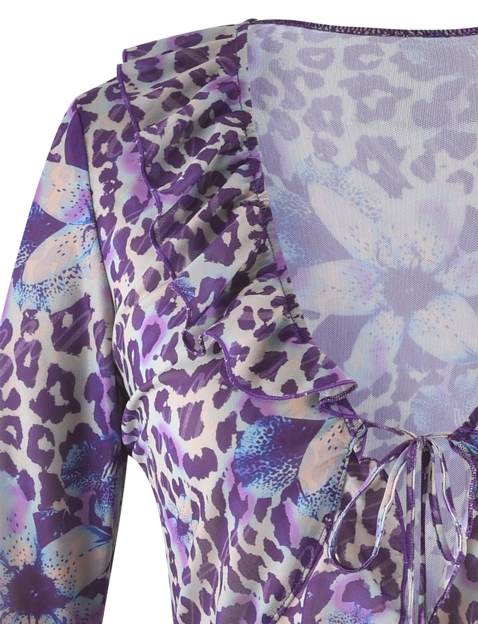 Close-up view of the TIGERMIST CORVIN MESH TOP - BLUE : BY POPPY LEOPARD, showcasing a lavender hue with a blend of leopard print and floral patterns. This sheer, lightweight fabric features a deep V-neckline adorned with ruffled edges and includes a charming front tie detail at the neckline.