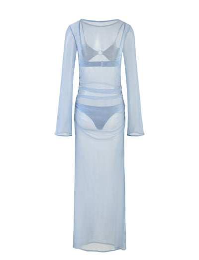 The ALAYNA THREE PIECE MAXI DRESS - BLUE from TIGERMIST, featuring a pale blue sheer, long-sleeved maxi dress with a crew neckline, is displayed over a matching bra and high-waisted underwear set. The outfit is layered to showcase a stylish and transparent look.