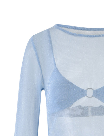 This image highlights a close-up of the ALAYNA THREE PIECE MAXI DRESS - PALE BLUE from TIGERMIST. The light blue top features long sleeves and a delicate, embedded design resembling a bralette with a central ring detail under the neckline. The sheer fabric has a slightly shimmery appearance.