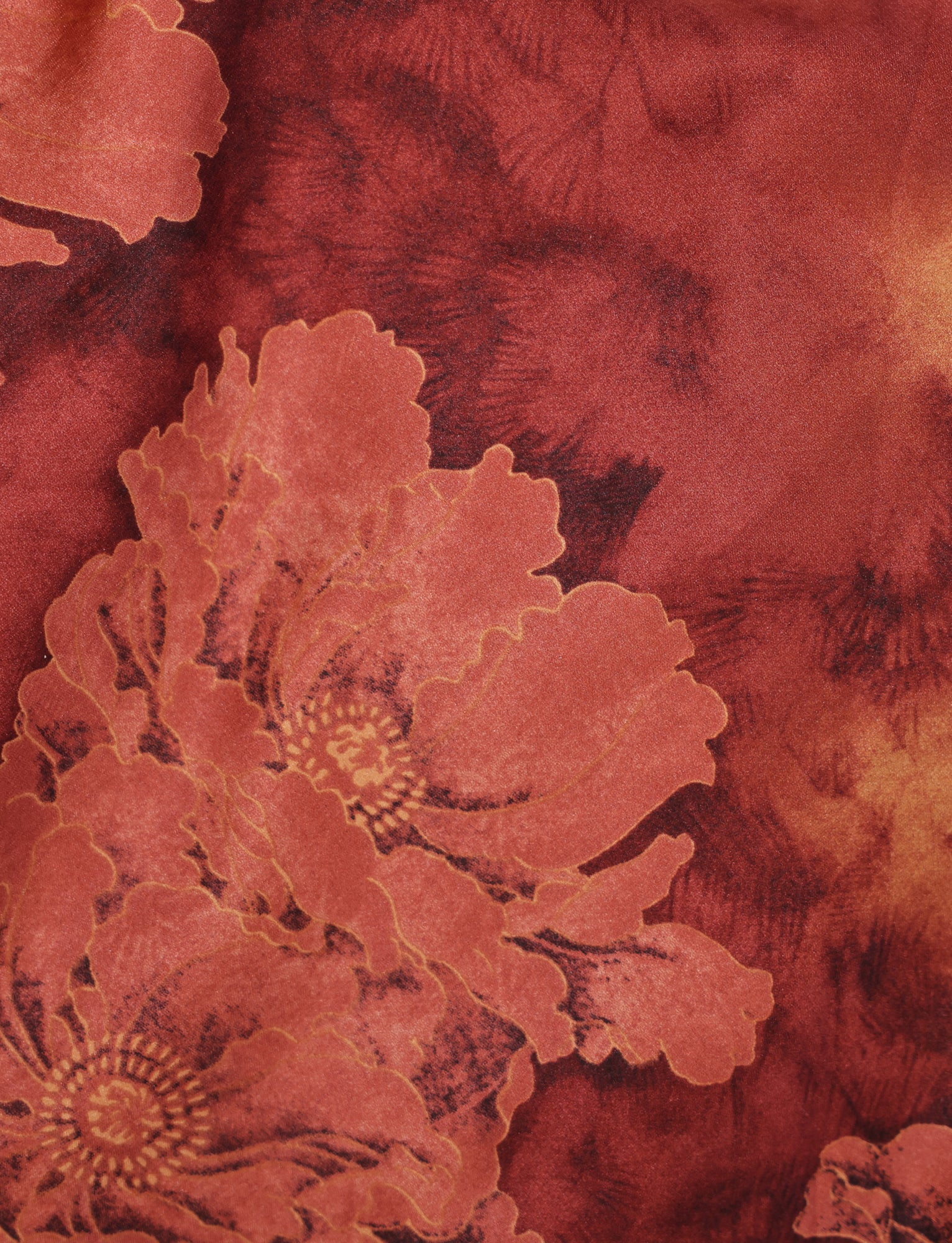 A close-up image of the MONROE DRESS - RED : FLORAL : WATER COLOUR by TIGERMIST highlights its vivid design, featuring large peony-like flowers in shades of red and orange against a marbled red background. The fabric texture is soft and slightly shiny.