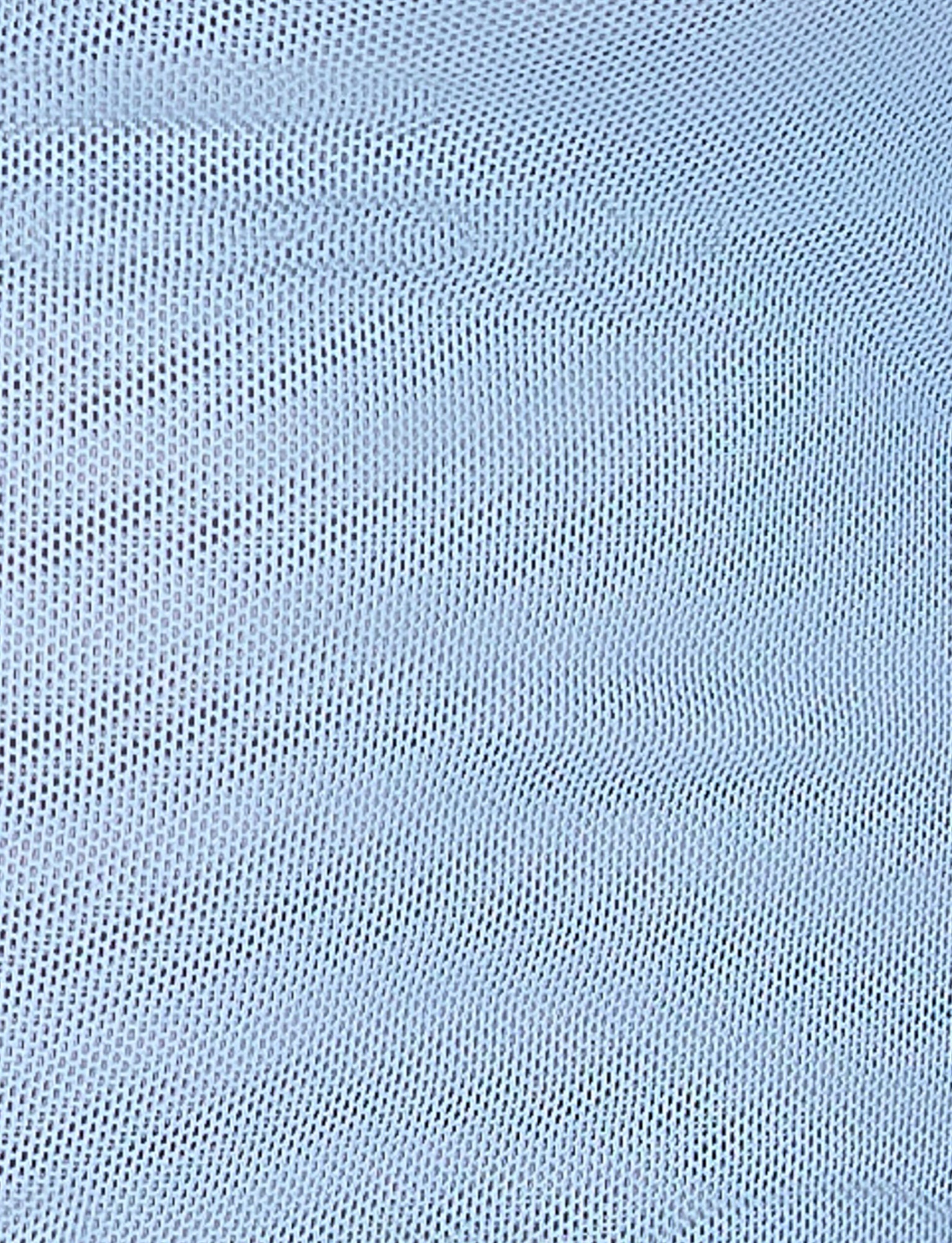 A close-up image of the ELVERA SKIRT - BLUE : GRADIENT FLORAL from TIGERMIST. The material features a textured design with small, evenly spaced holes that create a mesh pattern. The surface has slight undulations, forming gentle waves across the fabric. The overall appearance is uniform and consistent.