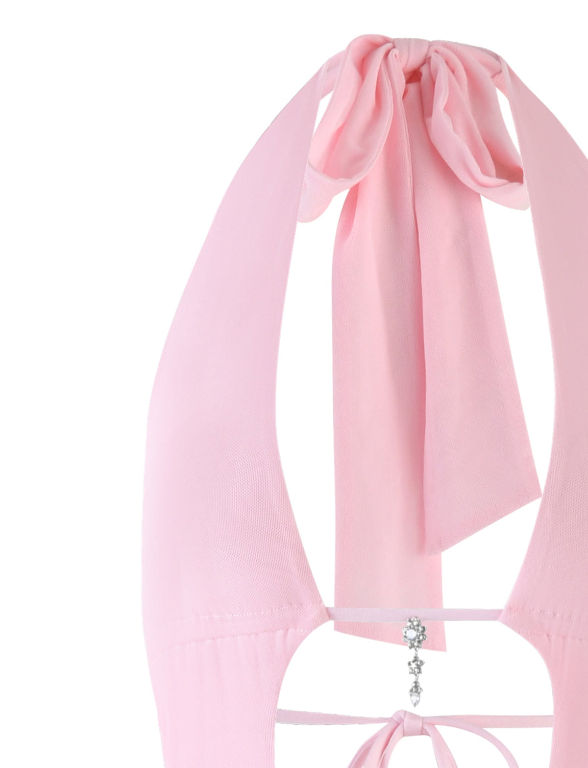 Close-up of a pale pink Esha Maxi Dress from TigerMist featuring a large bow tied at the neck. The fabric is light and slightly sheer. In the center back, two thin straps crisscross, adorned with small silver bead accents hanging down.