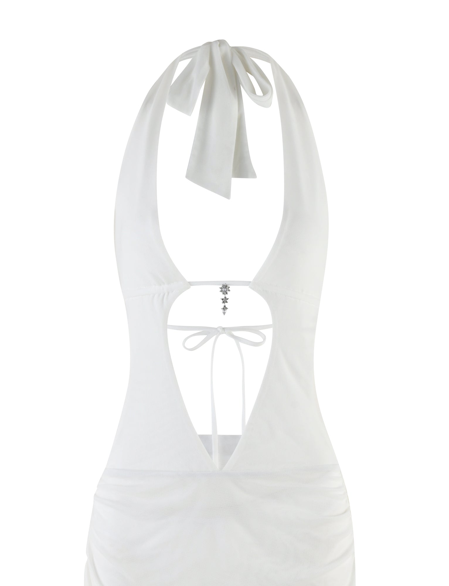 The ESHA MAXI DRESS - WHITE by TIGERMIST is an exquisite halter-style design, showcasing a beautiful open back elegantly tied with a ribbon at the neck. Its bodycon silhouette enhances the figure, and charming details like a star-shaped embellishment and a thin strap near the waist complete the look.