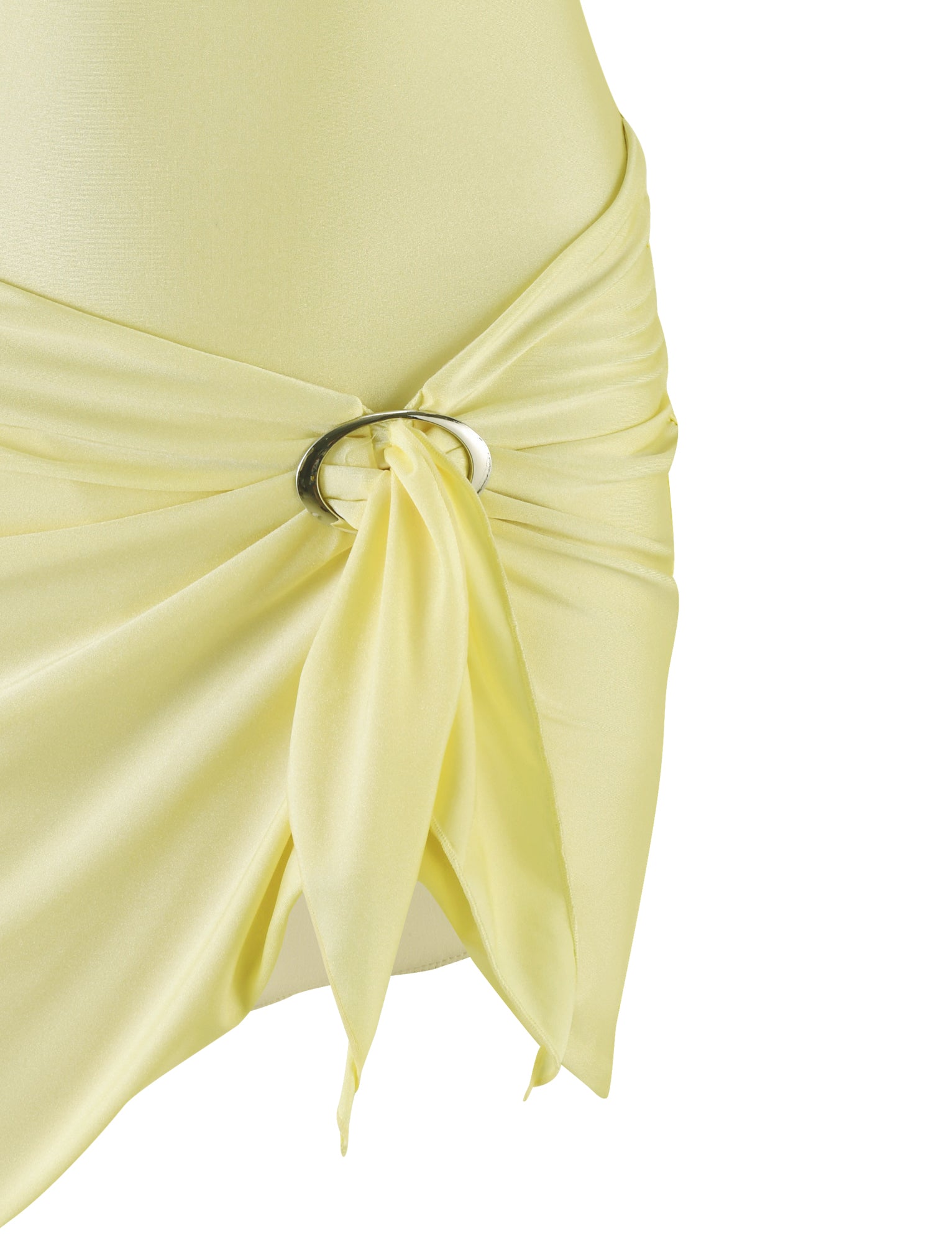 Close-up of the ELYSIA DRESS - YELLOW : BUTTER by TIGERMIST, featuring a centered gathering secured with shiny metallic rings. The shimmer jersey fabrication appears soft and slightly reflective, draping elegantly. The background is a plain white, emphasizing the dress's color and texture.