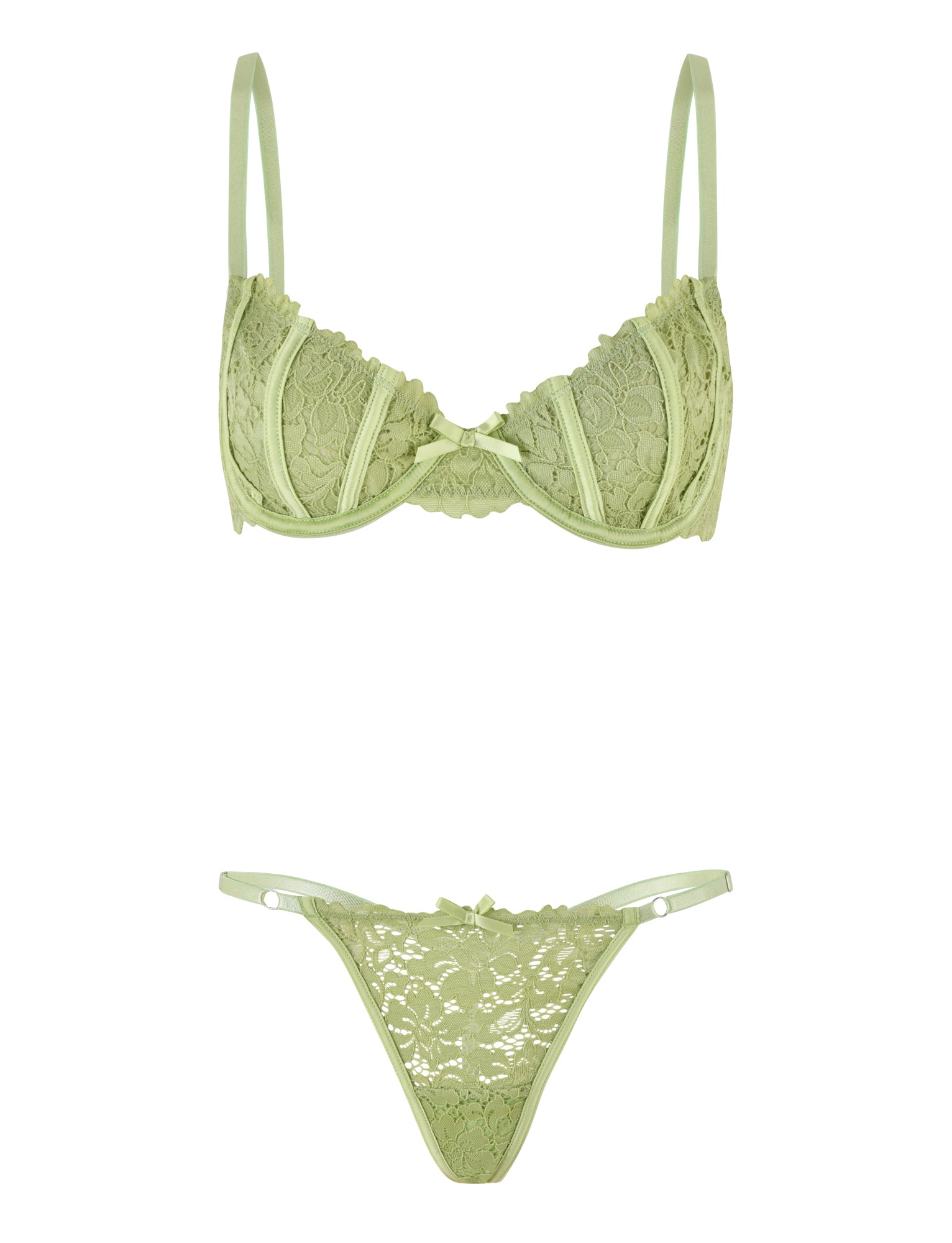The ROSALYN SET - GREEN by TIGERMIST is a light green lace lingerie ensemble that includes a coordinating bra and g-string with adjustable straps. The bra provides underwire support and showcases delicate floral lace patterns. Designed for comfort, the high-stretch fabric complements the g-string's low-rise fit, adorned with matching lace details and thin side straps.