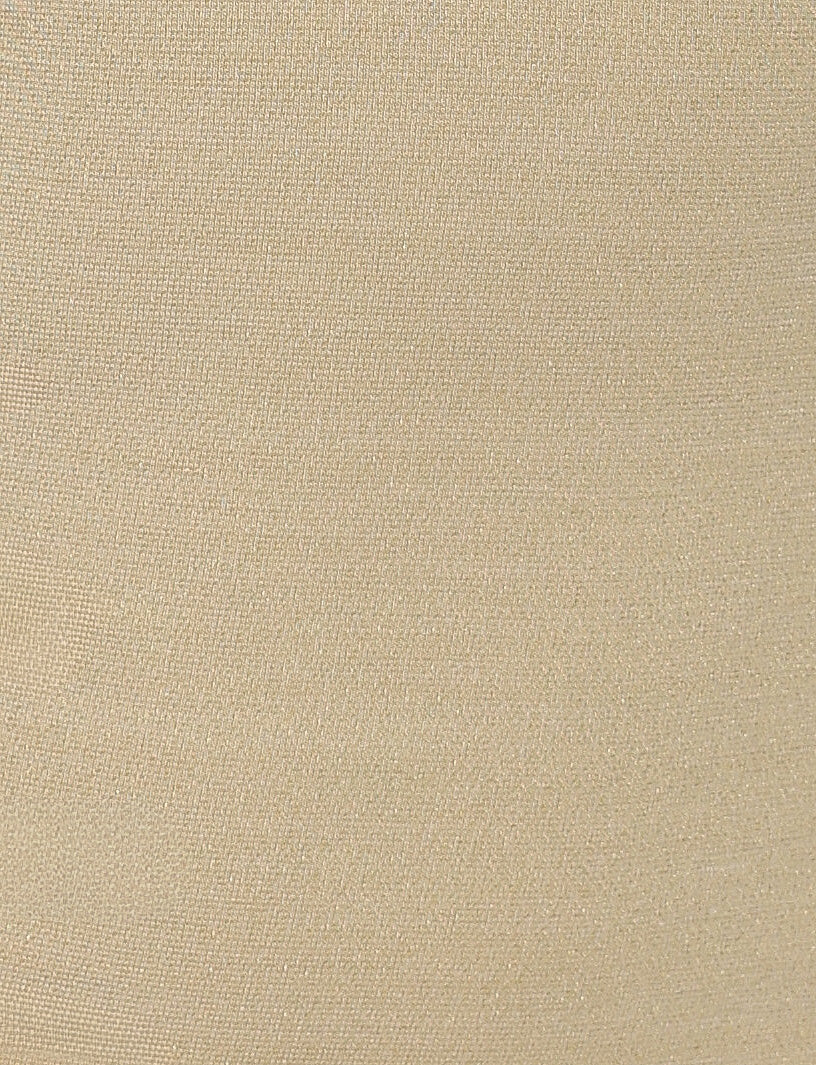 A close-up view of the OPELI DRESS - GOLD by TIGERMIST reveals a beige fabric with a fine, smooth texture. The fabric appears to be evenly woven, displaying a subtle sheen under the light. Reminiscent of TIGERMIST's elegant simplicity, there are no distinguishable patterns or designs visible on the surface.