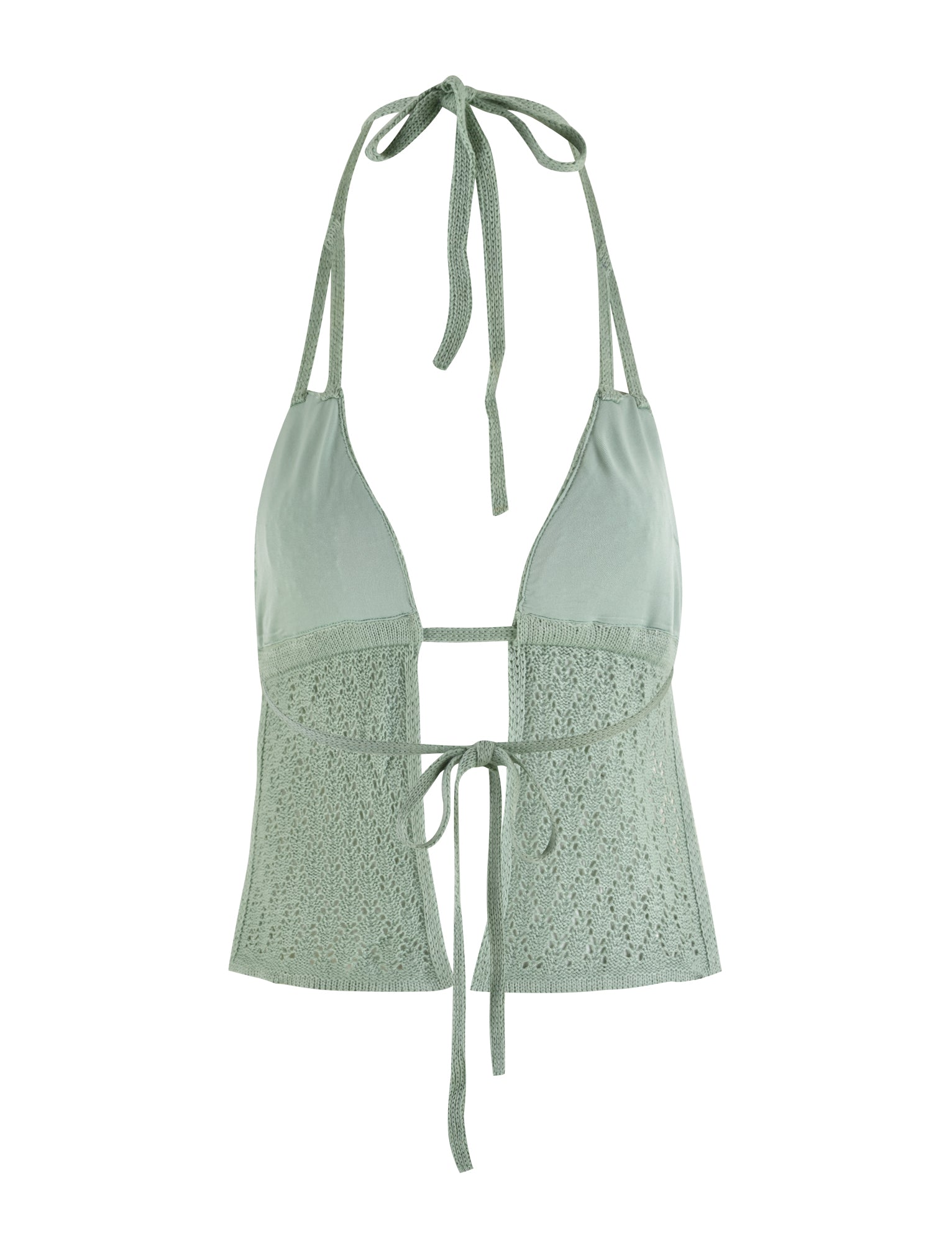 The COLLINA TOP - GREEN by TIGERMIST is a light green crochet halter top with functional halter ties at the back of the neck and an adjustable front tie. It features a blend of solid fabric and intricate crochet patterns below the bust, providing both style and comfort.