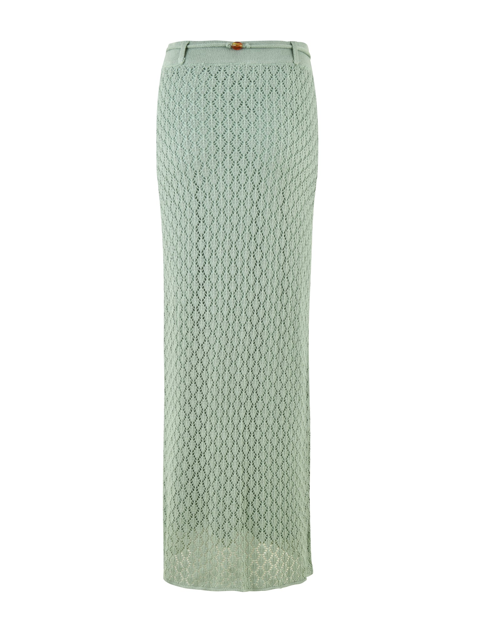 The image showcases the COLLINA SKIRT - GREEN from TIGERMIST, a stunning long light green crochet skirt with a fitted waistband and a small button detail. This elegant maxi-length piece features a delicate open-knit pattern and gracefully extends to the ankles, providing both breathability and sophistication.