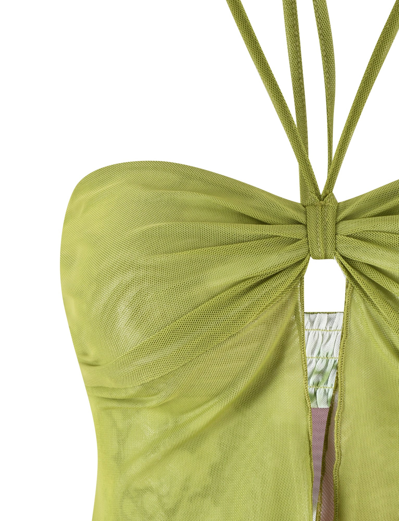 A close-up of the WAVERLY TOP - GREEN : FLORAL : STRIPE by TIGERMIST showcases a light green halter-neck design adorned with multiple thin straps. The ruched bodice features a knotted center, forming a keyhole opening below the knot. Crafted from slightly sheer, stretchy fabric, this top exudes both elegance and comfort.