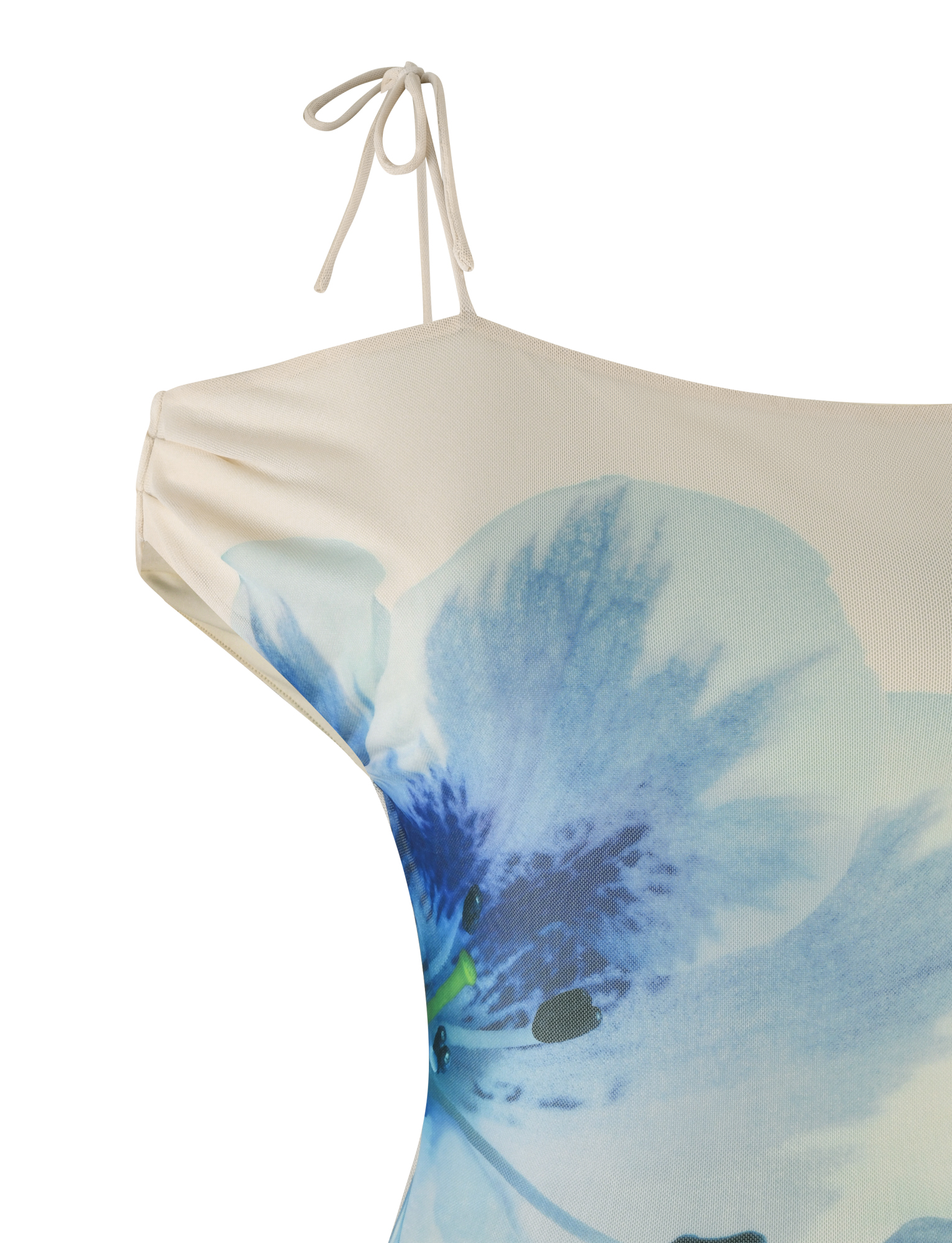 Close-up of the LILLIAN TOP by TIGERMIST—an off-the-shoulder cream floral top with a thin shoulder strap, asymmetrical neckline, and large blue flower print.