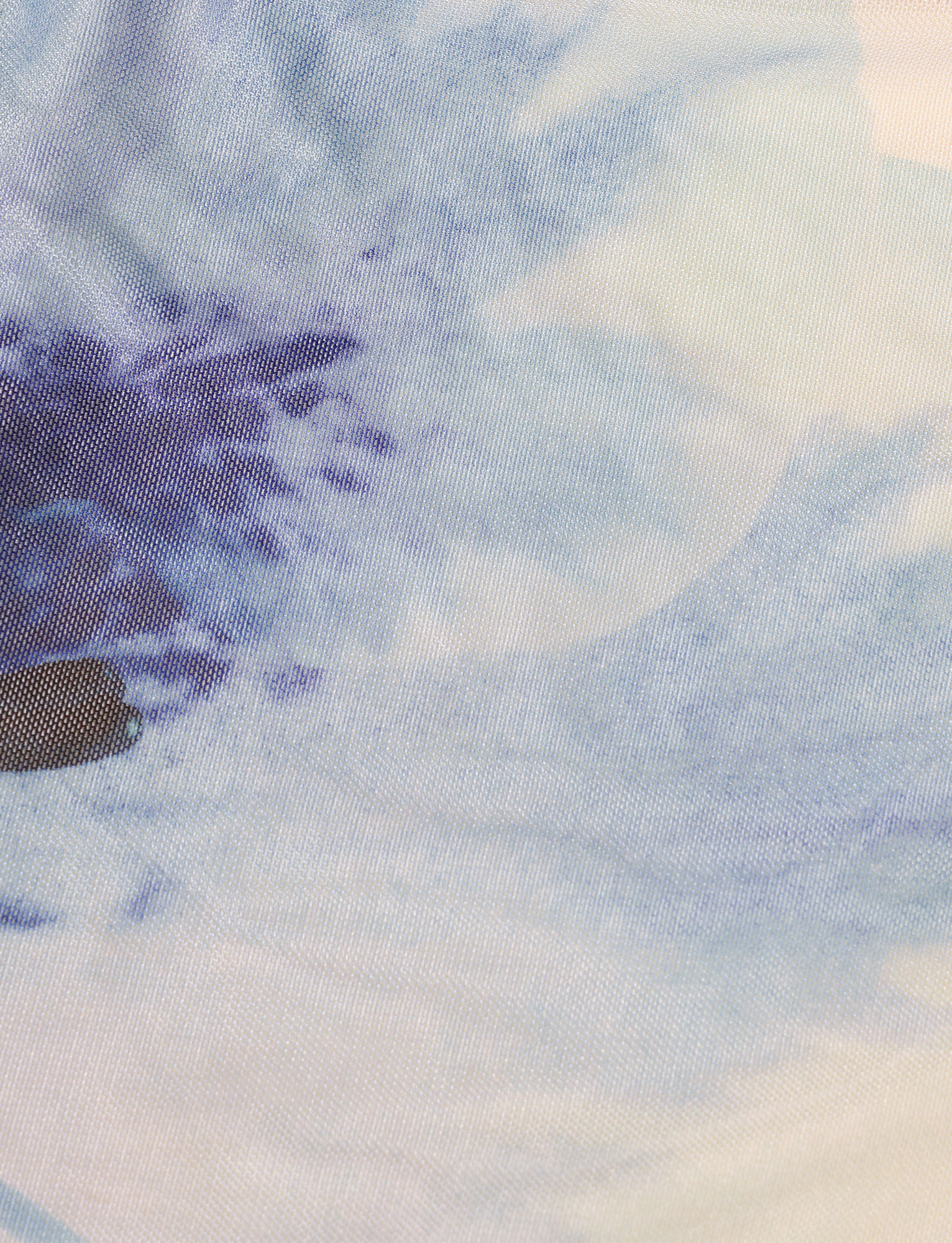 Close-up of the TIGERMIST LILLIAN TOP in white and cream floral, showcasing a soft abstract pattern with visible mesh textile weave.