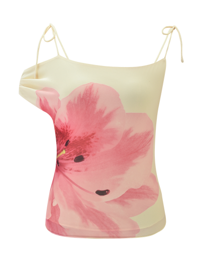 The LILLIAN TOP by TIGERMIST is a yellow spaghetti strap camisole adorned with a bold, vibrant pink floral design on the front.