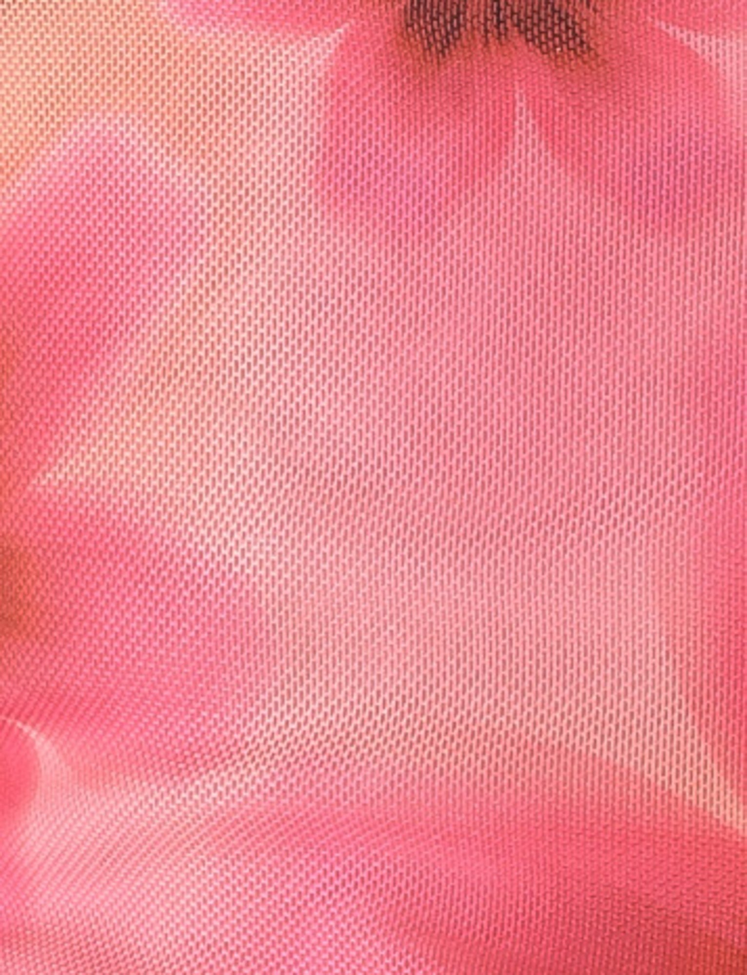 A close-up of the FRANCIS TOP - MULTI : OMBRE : FLORAL by TIGERMIST, showcasing a pink textured fabric with blurred floral prints in various shades of pink. The soft, feminine appearance and lightweight, airy texture suggest mesh fabrication, making it ideal for a floral print top.