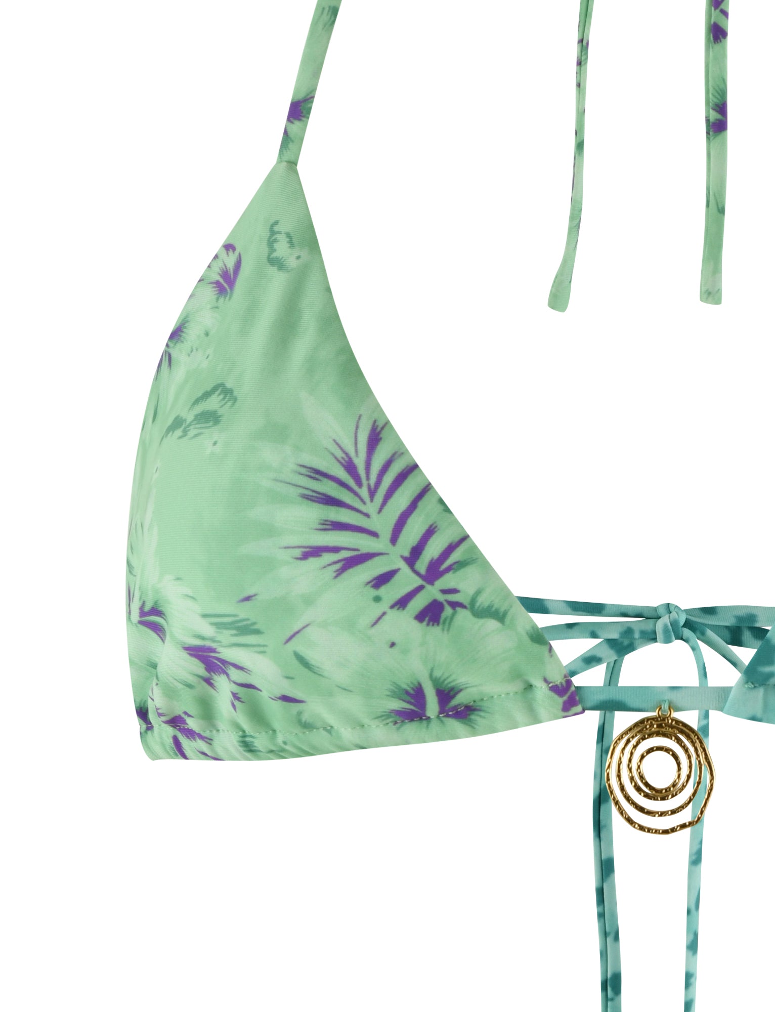 A detailed view of the AUTUMN BIKINI TOP - GREEN : FLORAL : ANIMAL by TIGERMIST highlights its mint-green and purple floral and animal print with thin straps. Gold circular pendant accents adorn the string ties below the triangle-shaped cups, while the material showcases a tropical leaf pattern. An adjustable underbust strap ensures a perfect fit. The background is plain white.
