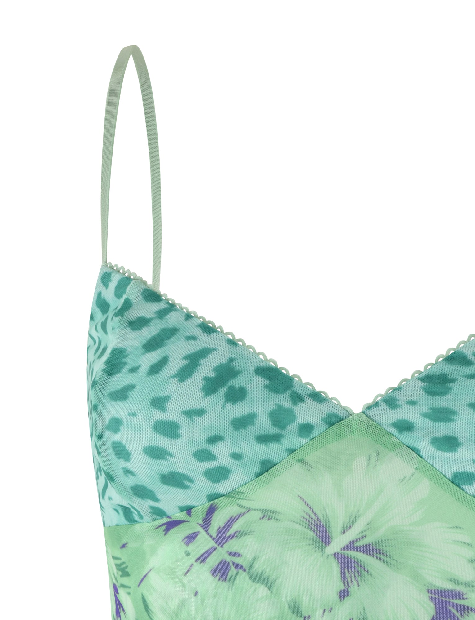 Close-up of the SAIGE TOP - GREEN : FLORAL : ANIMAL by TIGERMIST. The top showcases a beautiful blend of green and mint-colored floral and animal prints, accented with light purple hues, featuring delicate lace trim. Elastic adjustable spaghetti straps ensure both comfort and a customizable fit.