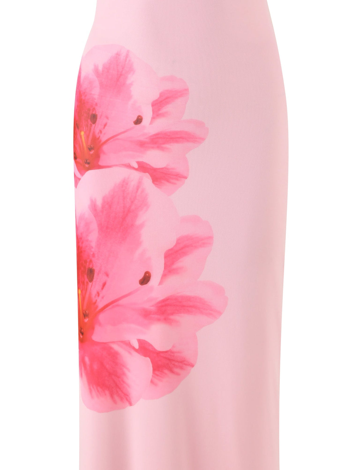 Close-up of the KARTER DRESS - PINK : BABY PINK from TIGERMIST, featuring a smooth light pink fabric adorned with a large, vibrant print of two pink flowers with reddish centers. The material appears smooth and suggests that this piece is part of a maxi length dress.