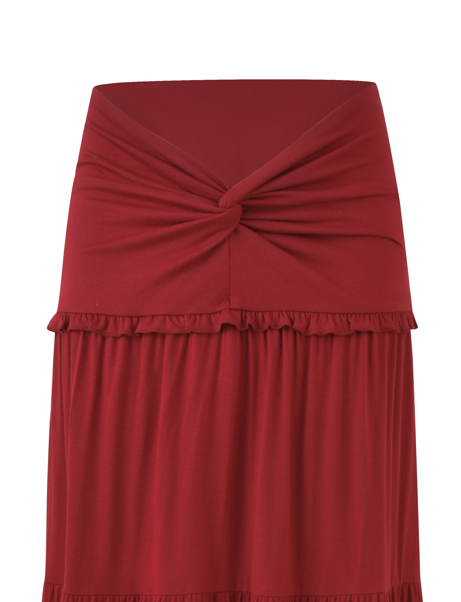 The KATYA MAXI SKIRT by TIGERMIST is a red maxi skirt made from high stretch fabric, featuring a wide waistband with a twisted knot detail and a small ruffled trim.