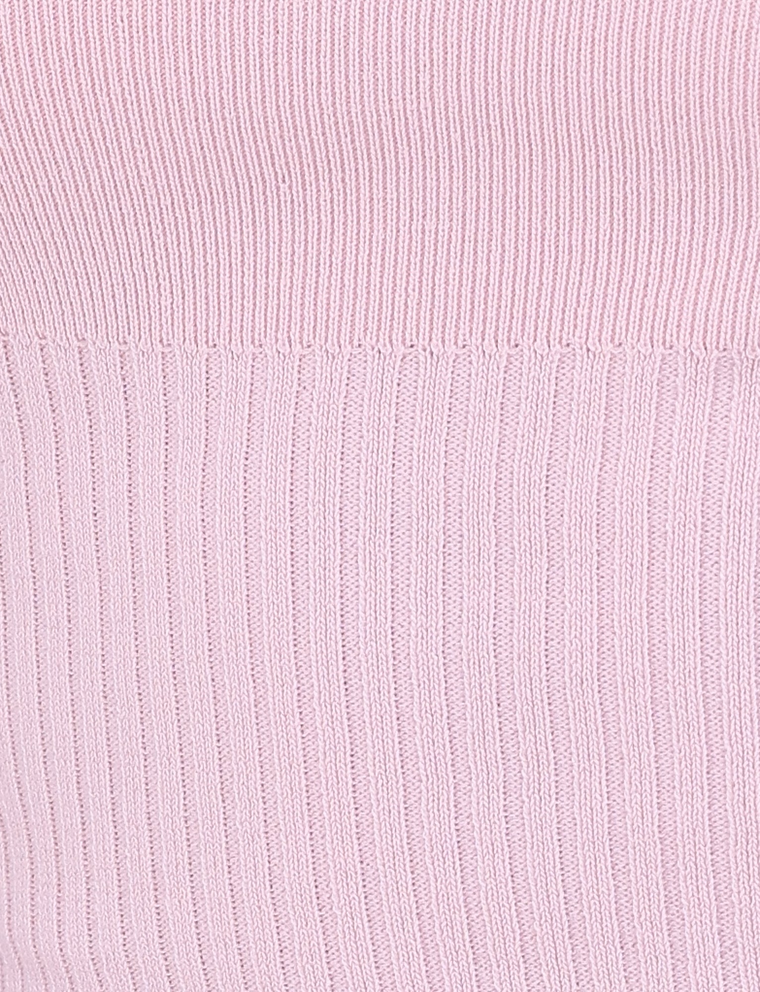 Close-up of the TIGERMIST GREER DRESS in BABY PINK, featuring a vertical ribbed knit fabric that is ideal for a mini dress. The texture, with its distinct ridge and groove design, creates a soft and tactile appearance that complements the tie shoulder straps beautifully.