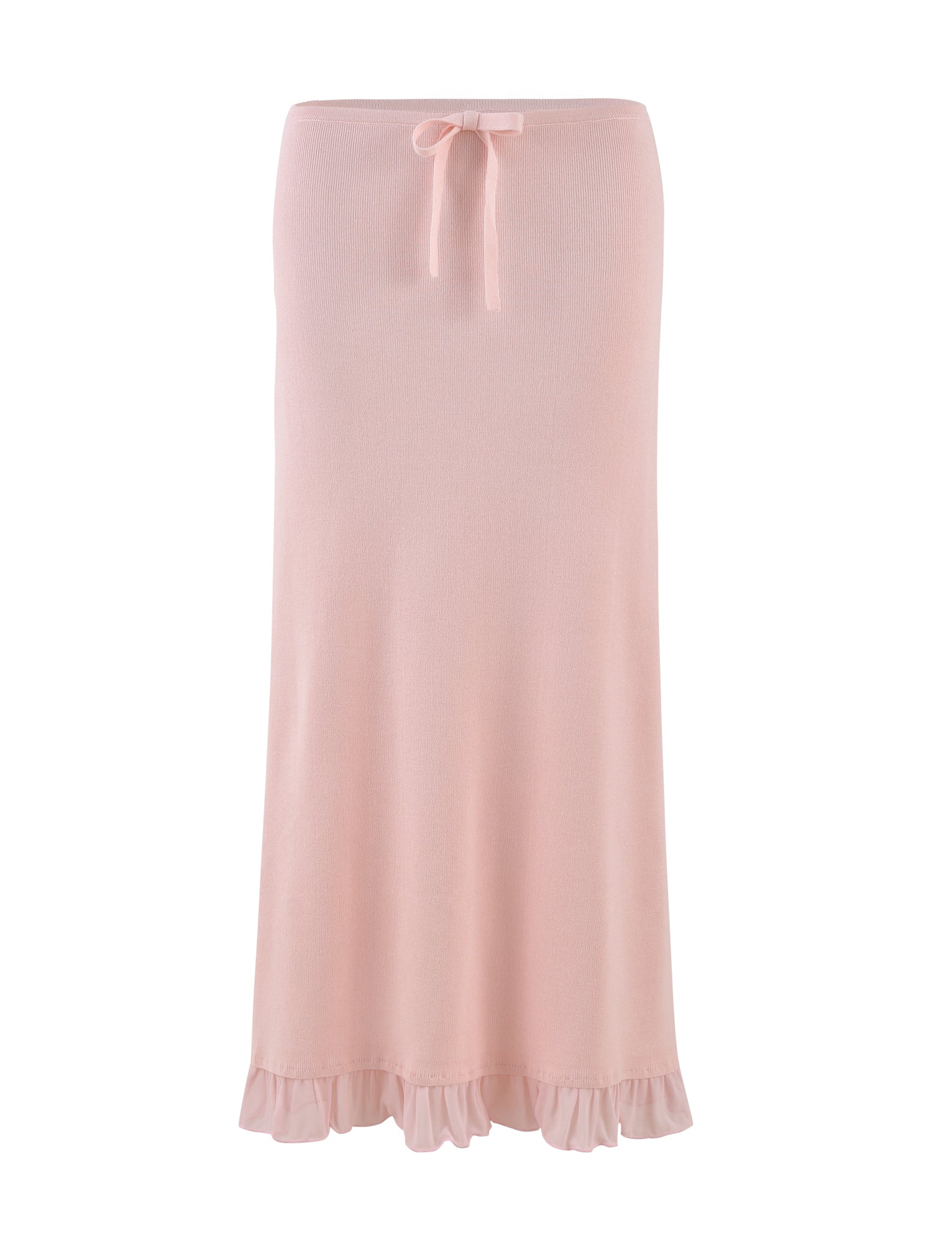 The TIGERMIST LILYANA SKIRT in Baby Pink is a long, pastel pink knit skirt with a relaxed fit, featuring a ruffled hem and a small bow at the waist. This elegant midi skirt is set against a white background.